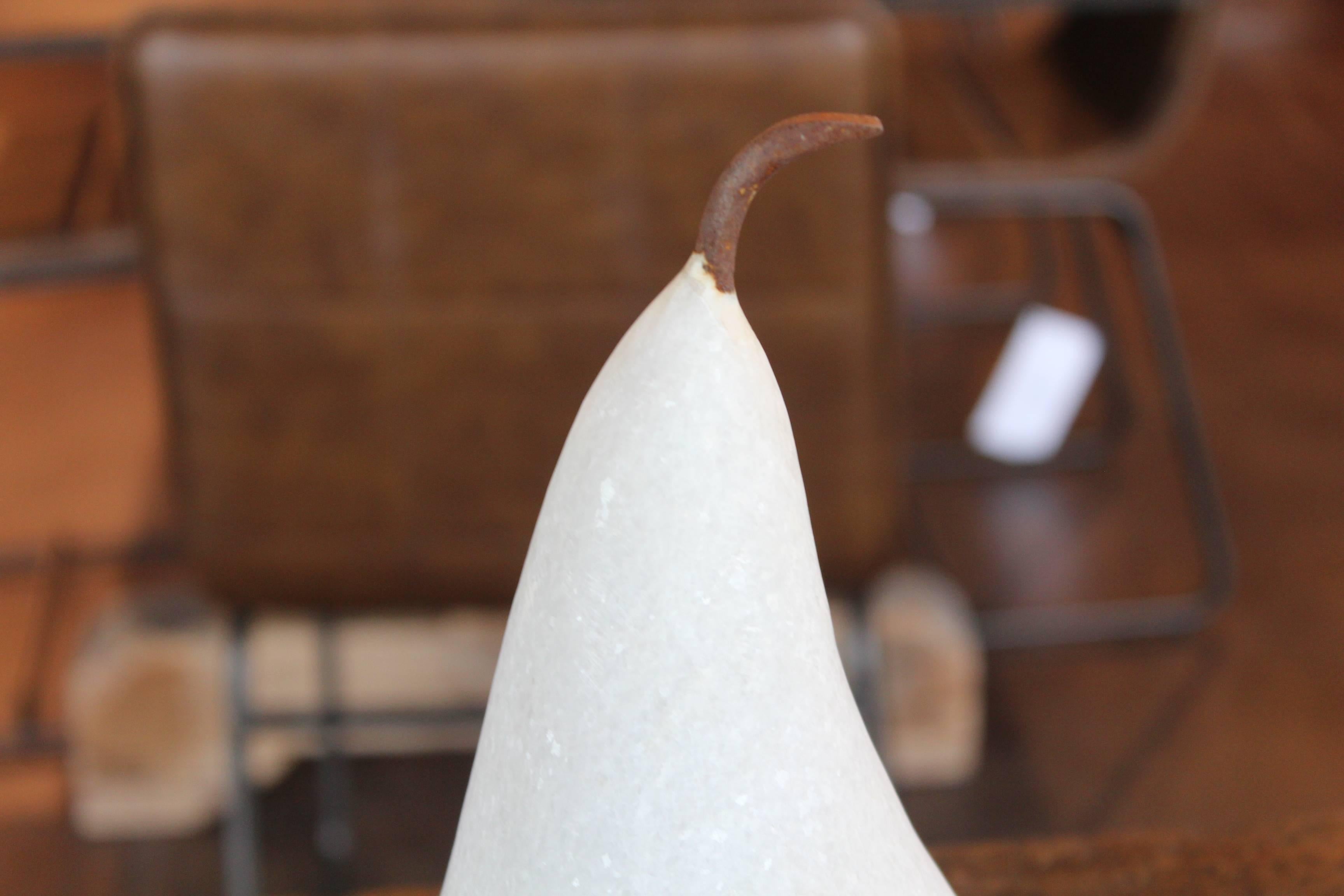 Large marble pear with iron stem.