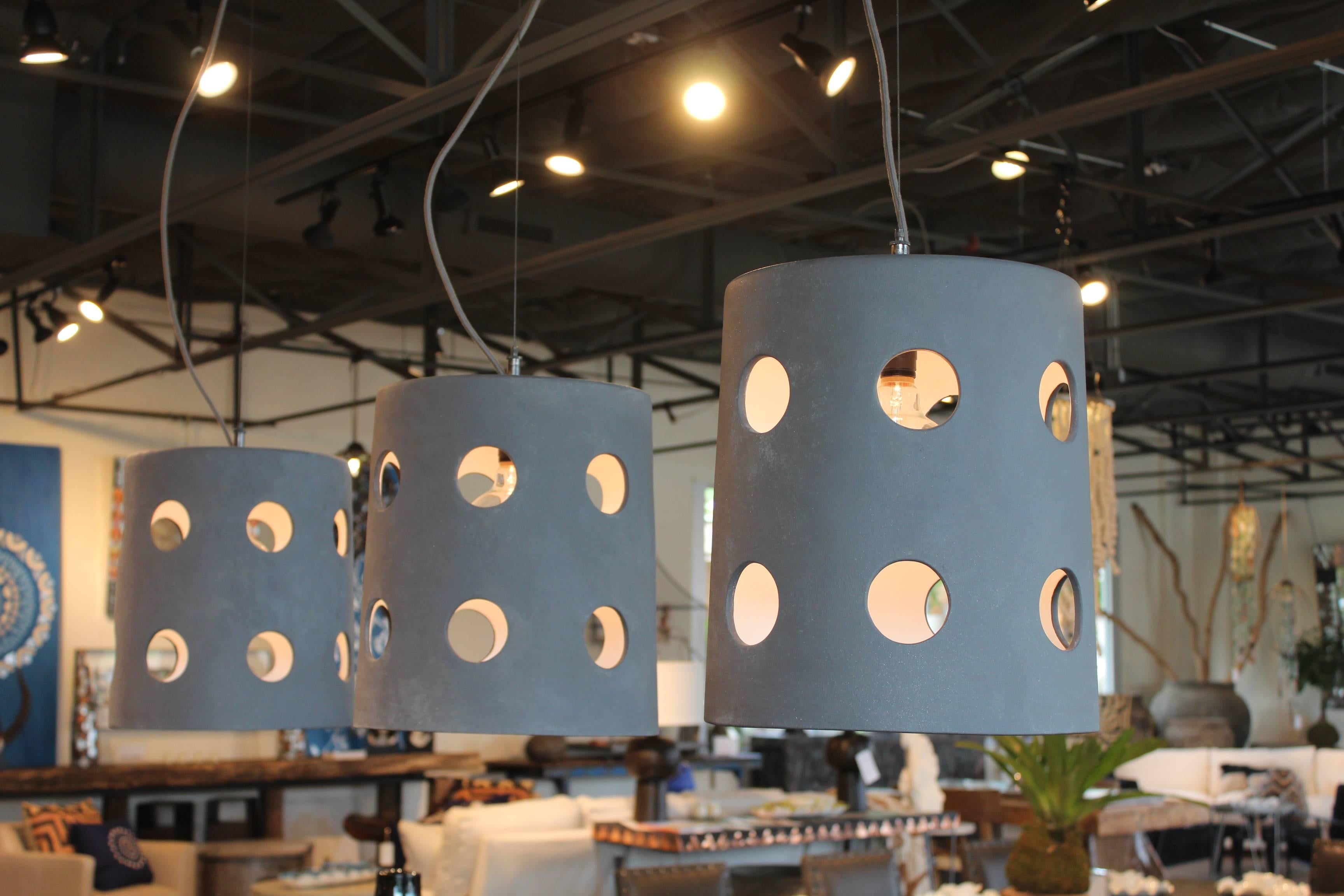 Artisan made contemporary cylinder pendant light with circle cut-outs in dove grey finish. Designed by Brendan Bass, made in Italy.


Brendan Bass Custom -  Item can be reproduced