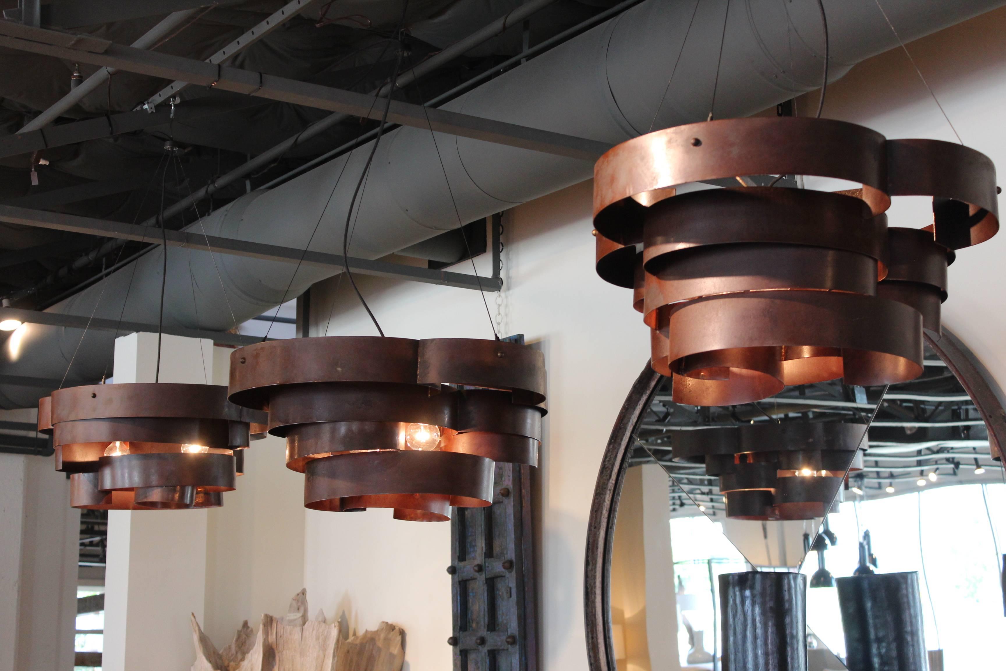 Sculptural steel chandelier in sealed natural rust. 
Designed by Brendan Bass. Made in Italy
Maximum wattage: 60 watts per socket.


Brendan Bass Custom -  Item can be reproduced