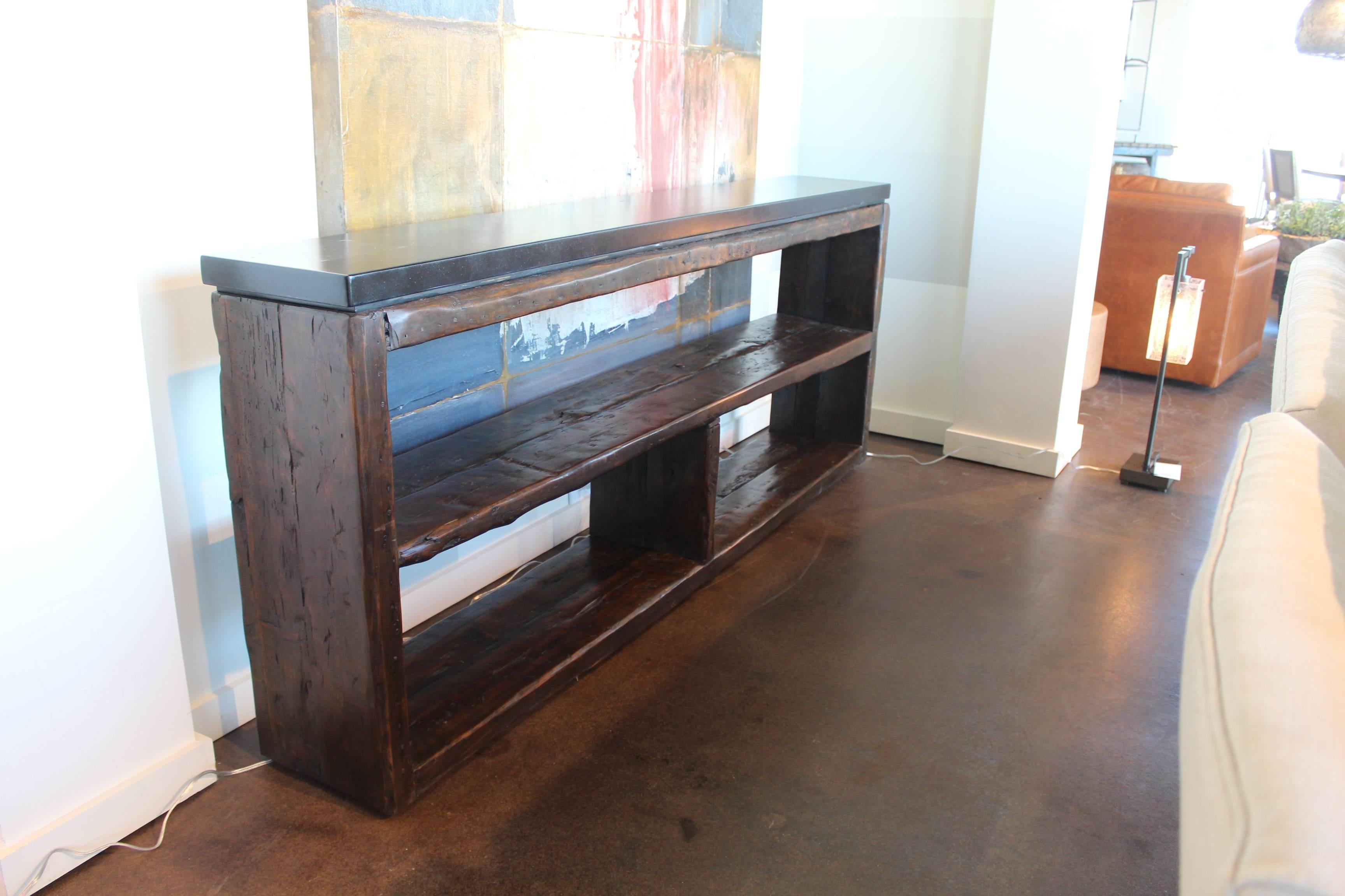 Console made from French re-claimed pine with ebonized limestone top.

Brendan Bass Custom - Item can be reproduced