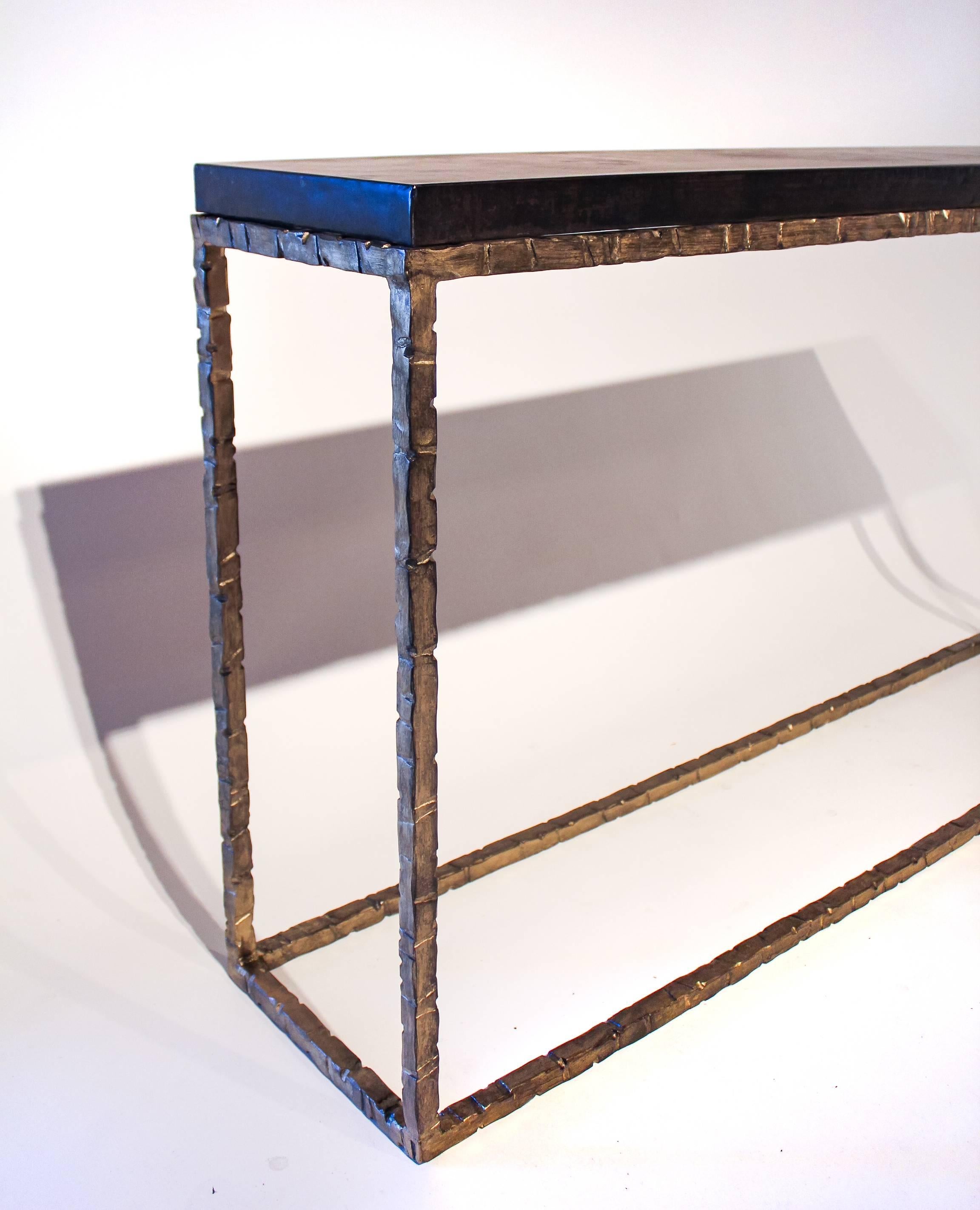 Hand-forged iron console with zin top.