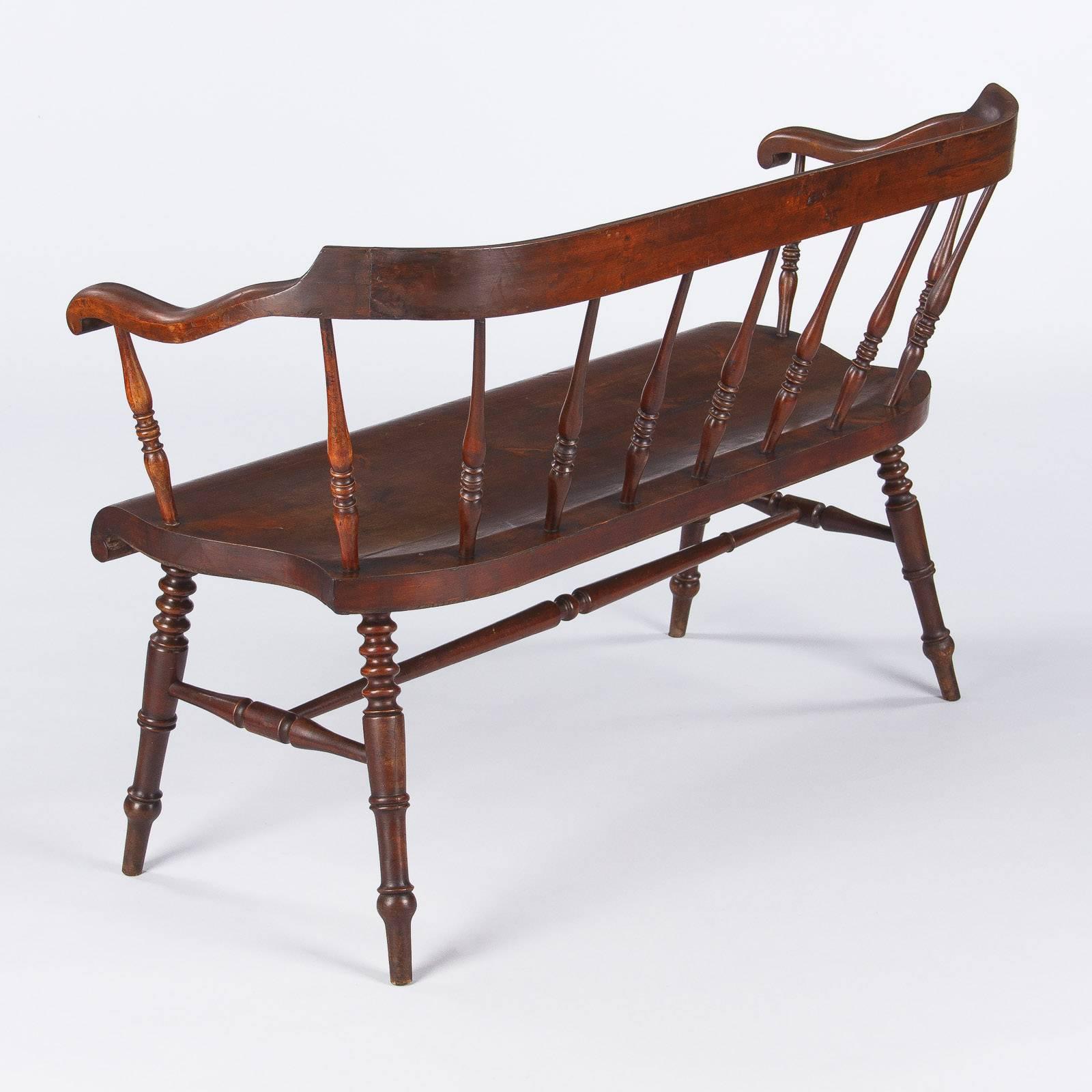 This handsome bentwood bench is attributed to Baumann, a furniture manufacture founded in 1901. Emile Baumann was a disciple of Thonet. This banister back bench is made of beech wood and poplar. The back, armrests and seat are curved. The turned