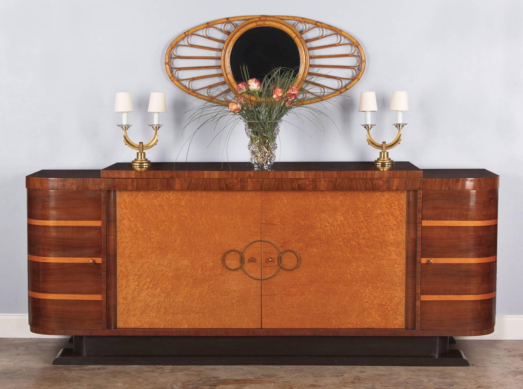 A spectacular French Art Deco four-door buffet attributed to distinguished designer from Lyon Francisque Chaleyssin (1872-1951). The Enfilade buffet, circa 1930s, features a burl walnut veneer top and curved side cabinets. The side cabinets have