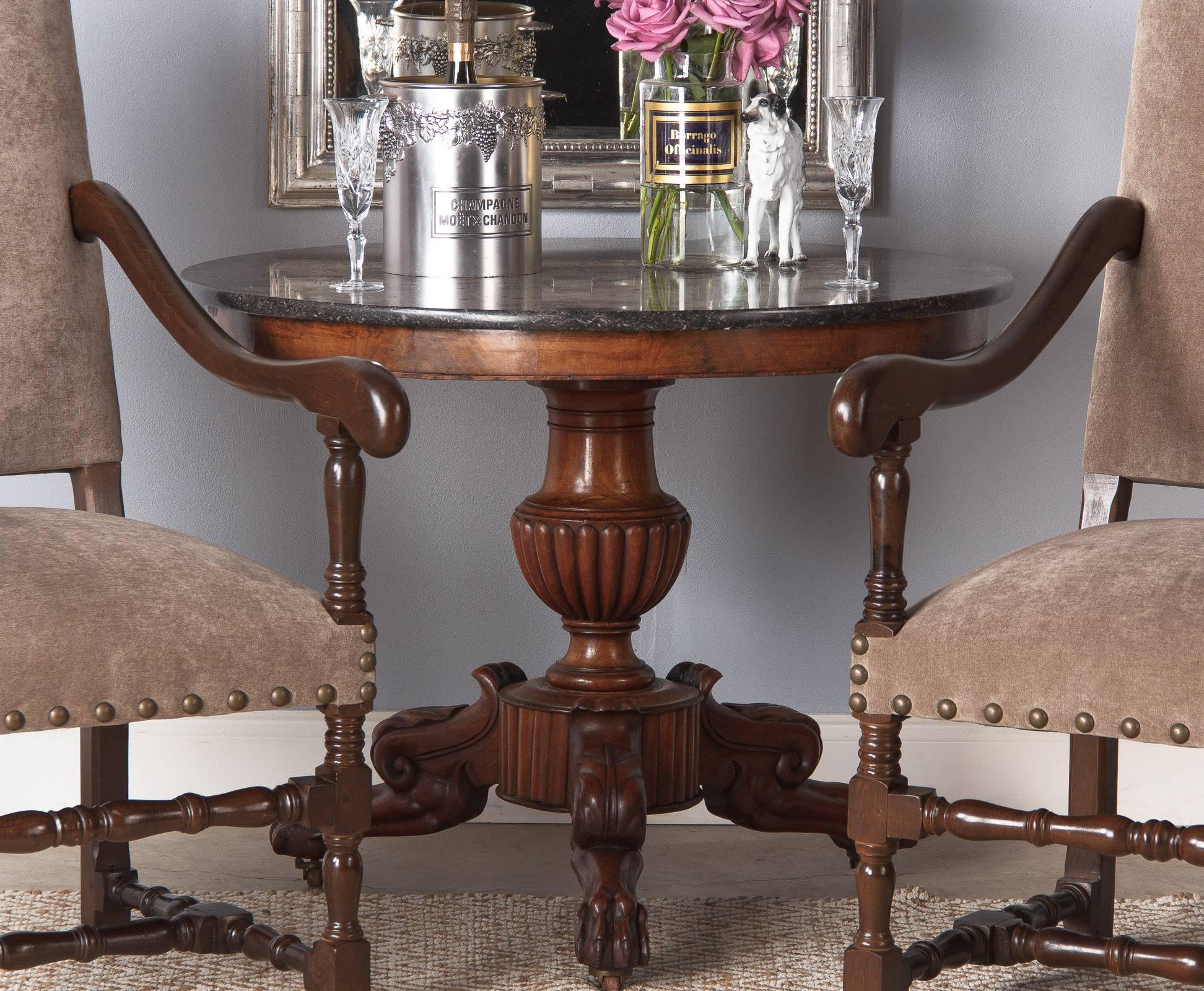 A wonderful pedestal table or gueridon from the Napoleon III period, circa 1870s. Found in a private home in the Loire Region, this center table is topped with a round black marble top. The walnut wood tripod base features a gadrooning bulb in its