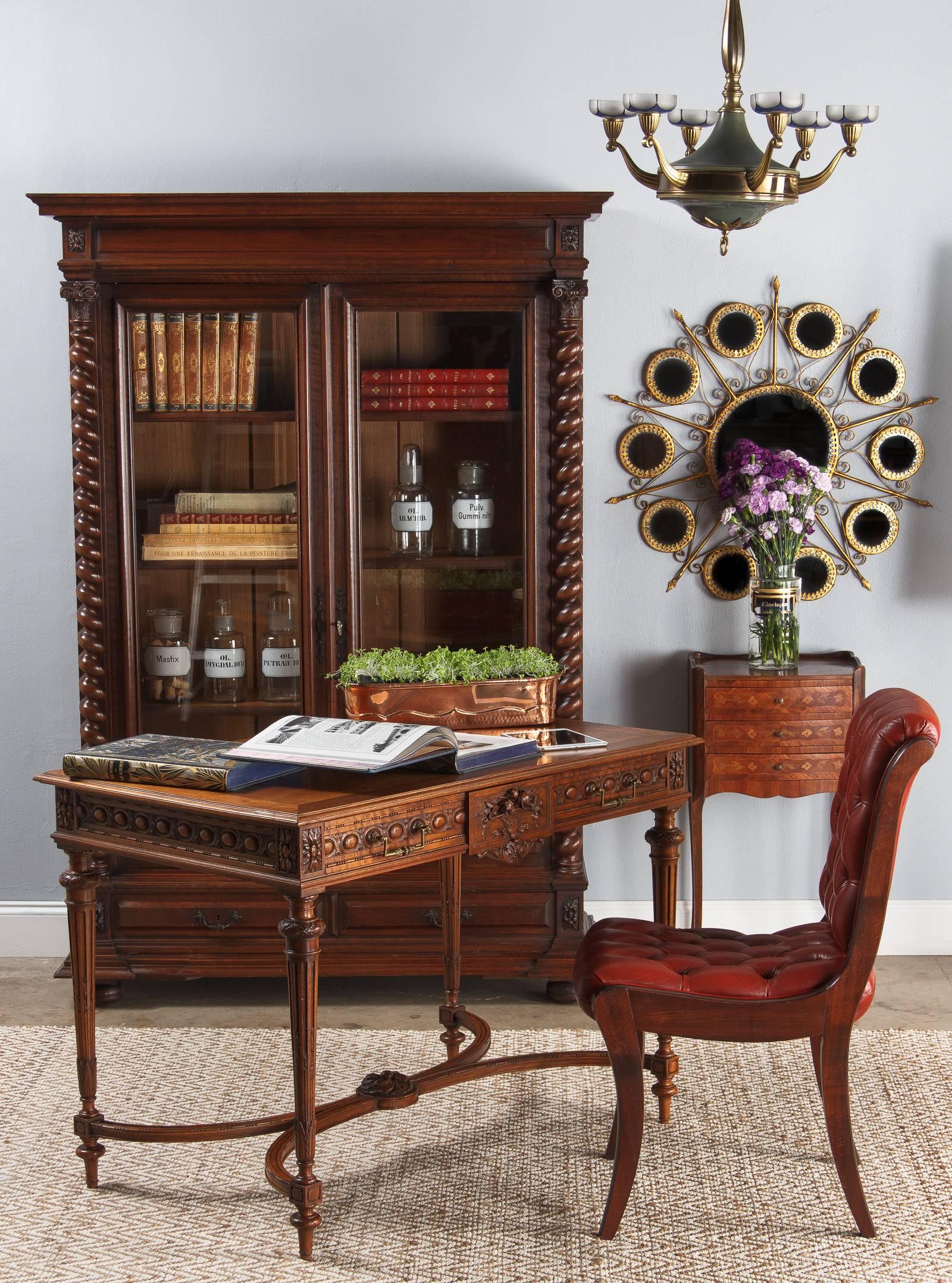 A phenomenal Louis XVI style desk in richly detailed cherrywood. This piece runs the gamut on period carvings, displaying nearly all of the Classic motifs for Louis XVI. A band of egg and dart runs along all sides of the apron, bordered by tidy