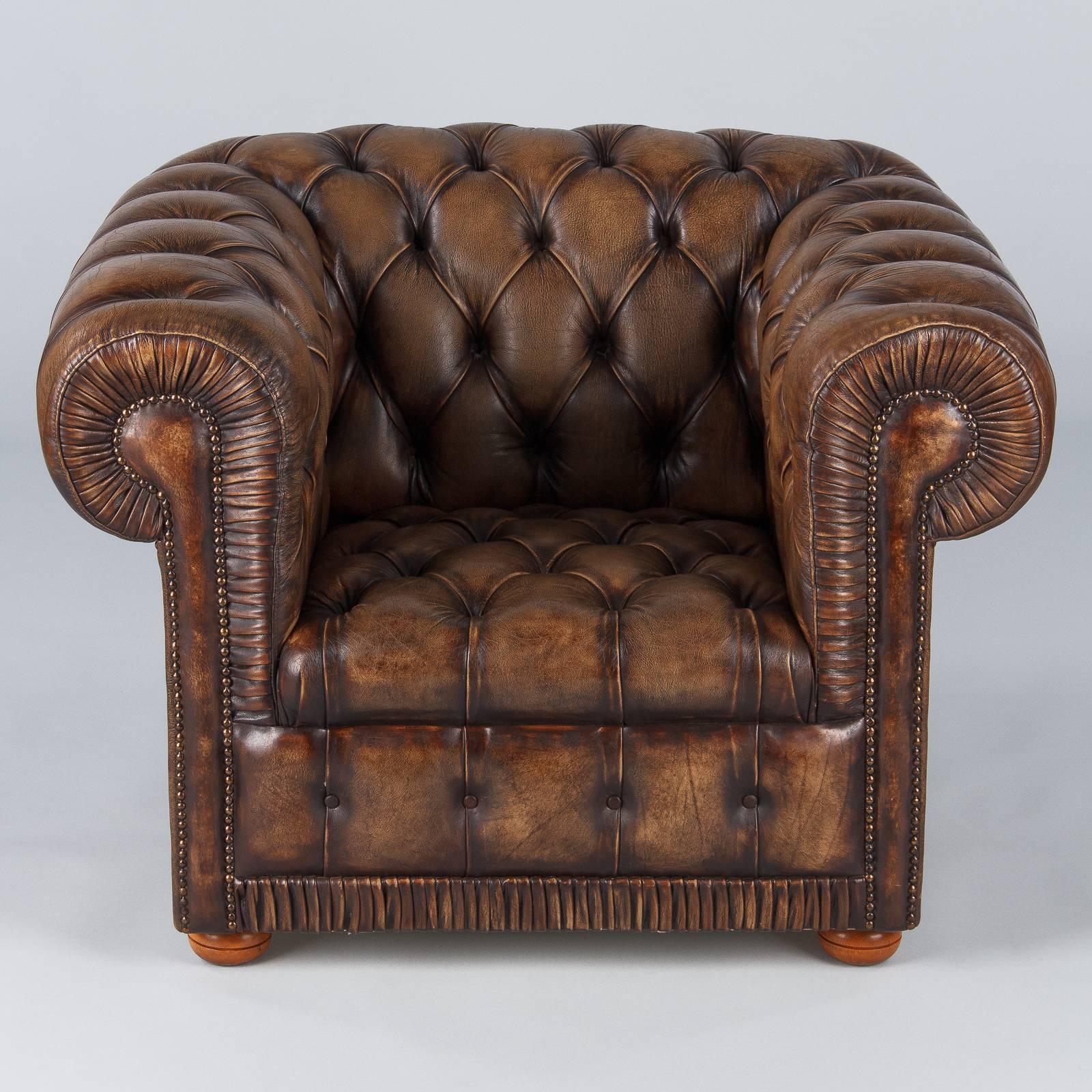 brown chesterfield armchair