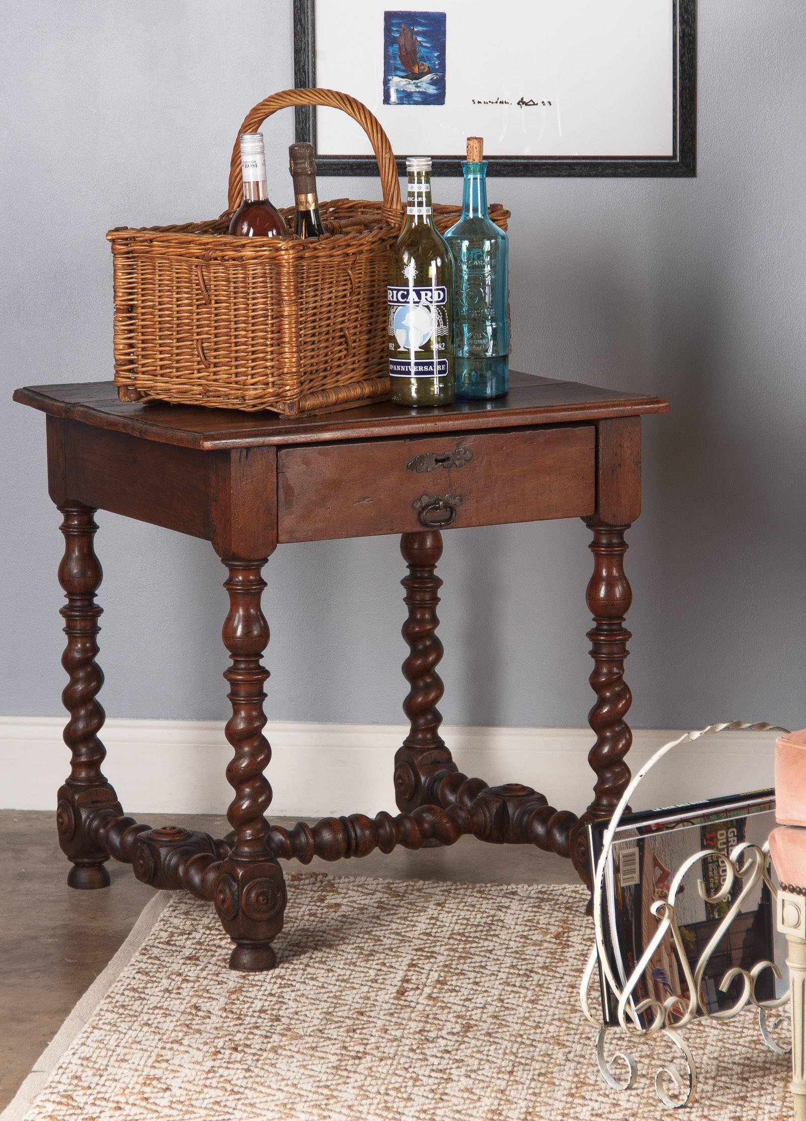 A French country wicker basket bottle holder with wicker wrapped handle. Using stacked and wicker-bound sticks, the basket is divided into eight separate compartments suitable for carrying bottles. Nicely aged with a lovely tan patina. The basket is