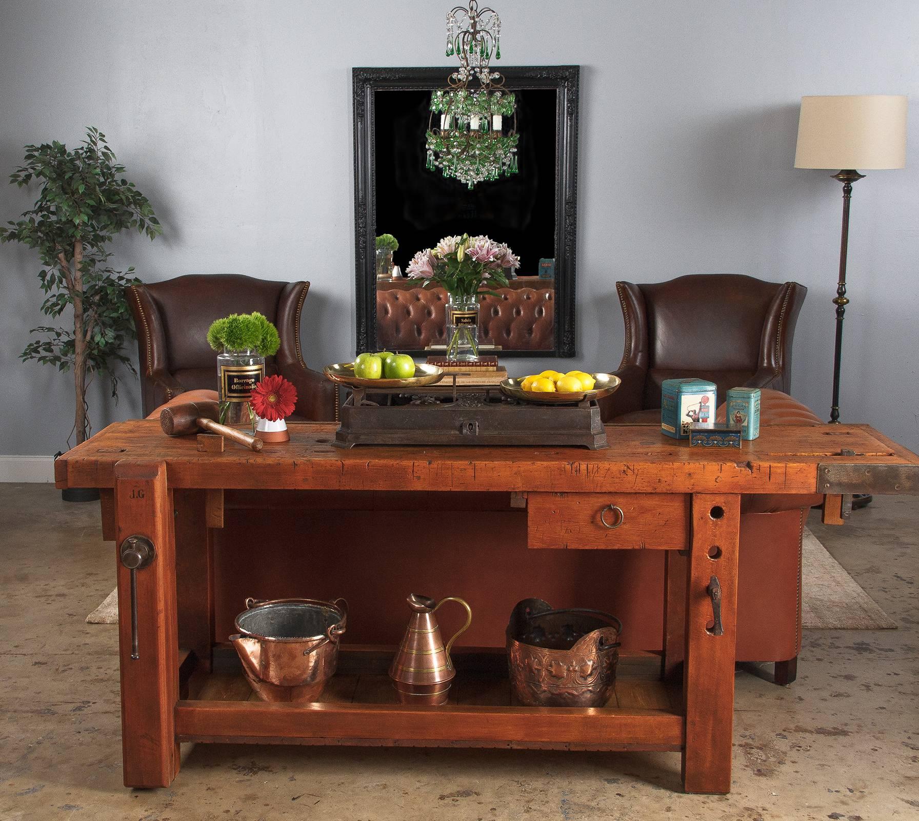 A fabulous working etabli, or carpenter's workbench constructed from beechwood, circa 1950. This piece was hand built by the cabinet maker who used it and bears his branded initials, 