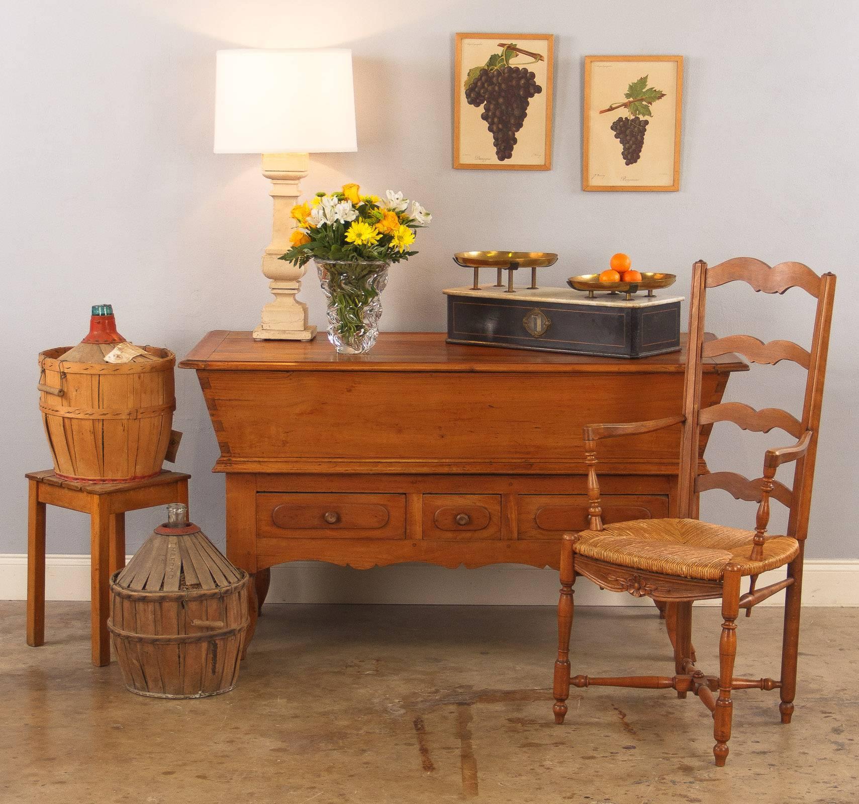 A pair of painted baluster-style wooden lamps, 20th century European. Two square architectural baluster pieces with lots of molding have been transformed into rustic lamps, both distress painted in an off-white with some light crackling and darker