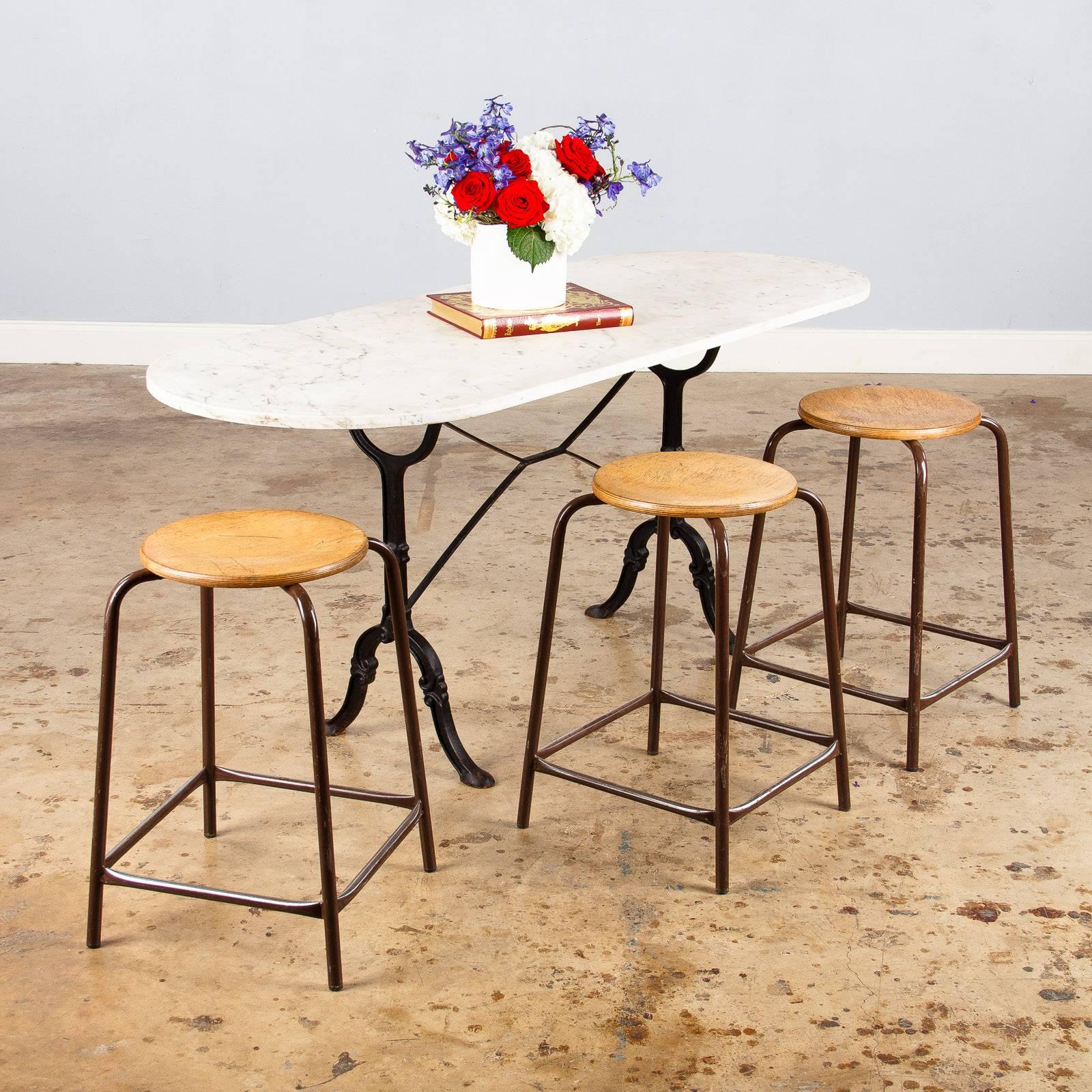 Set of Four French Vintage Wood and Metal Industrial Stools, 1950s In Good Condition In Austin, TX