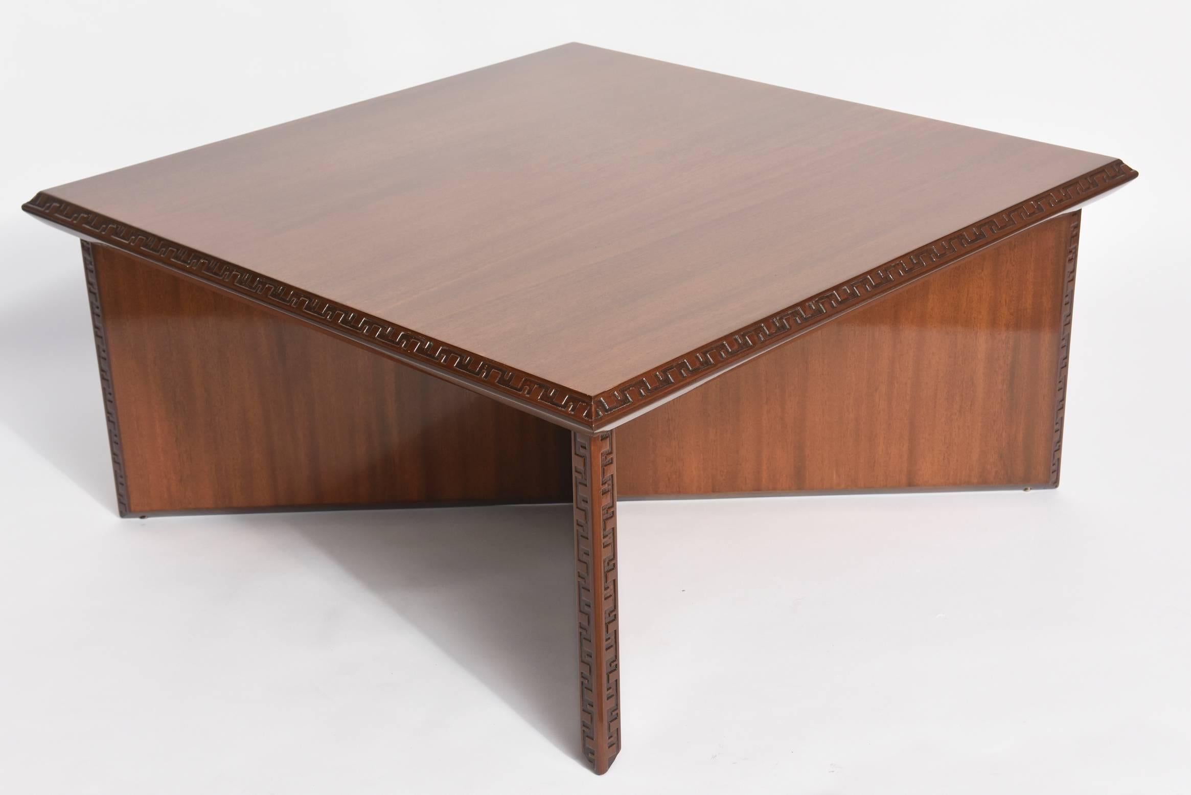 The square top with Greek key motif on edges above an "x" form base
heritage Henredon for Frank Lloyd Wright.