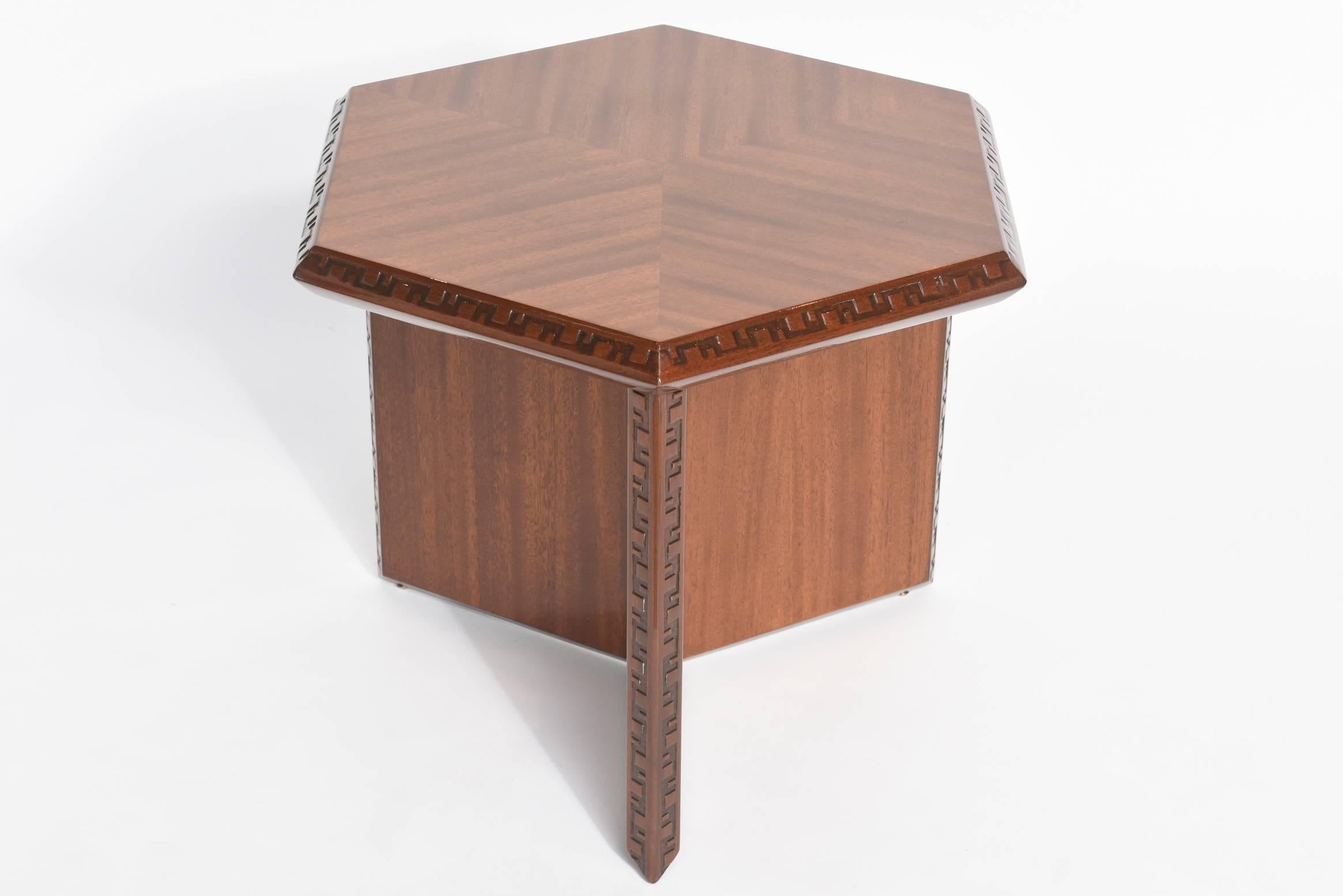 The hexagonal top with modified Greek key motif on conforming base with similar Greek key motif
Frank Lloyd Wright for Heritage Henredon.