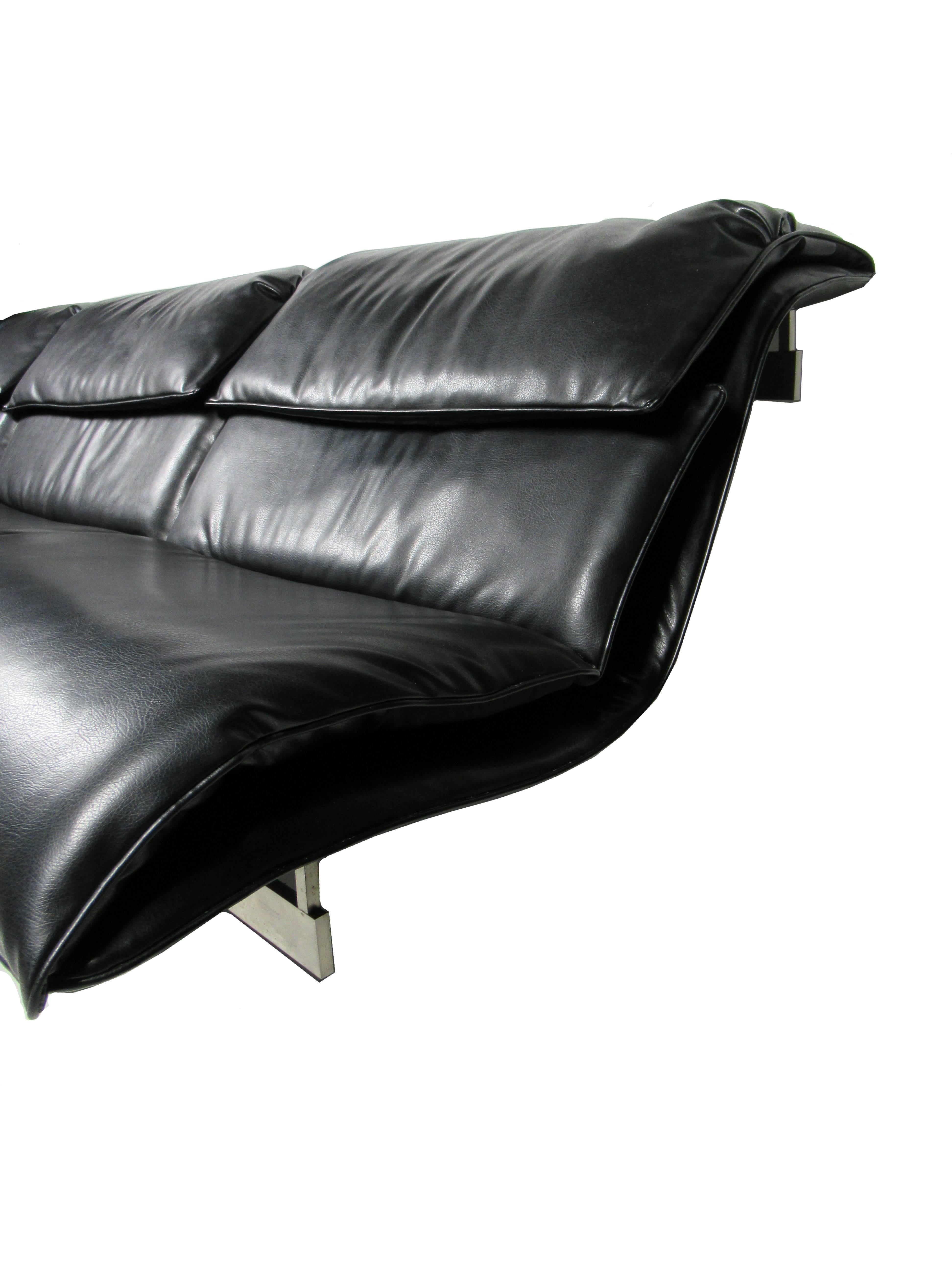 An Italian modern stainless steel and leather three-seat 