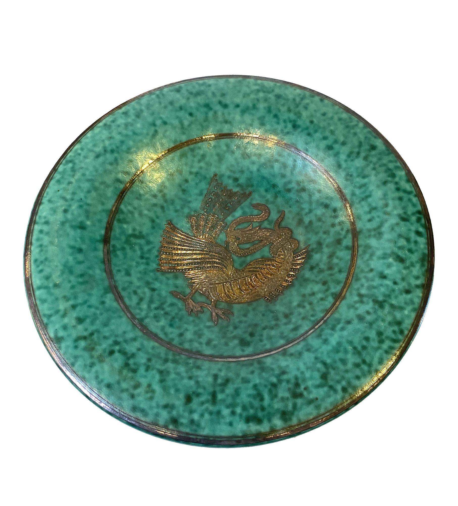 Pair of two round in rich turquoise glaze with silver overlay, provenance- collection of Howard Rothberg, can be sold individually.