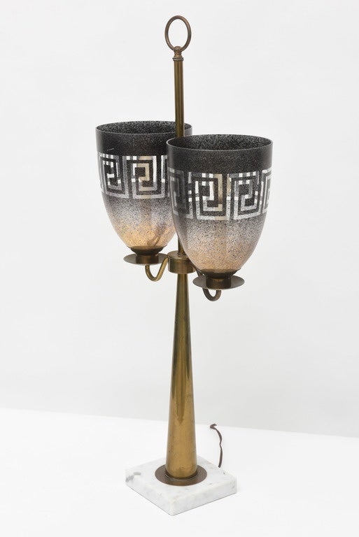 The brass cylinder with ring top and candle arms with glass photophores decorated with Greek key motif, on a marble base
Provenance: Eden roc hotel- zodiac room- then private Miami collection.