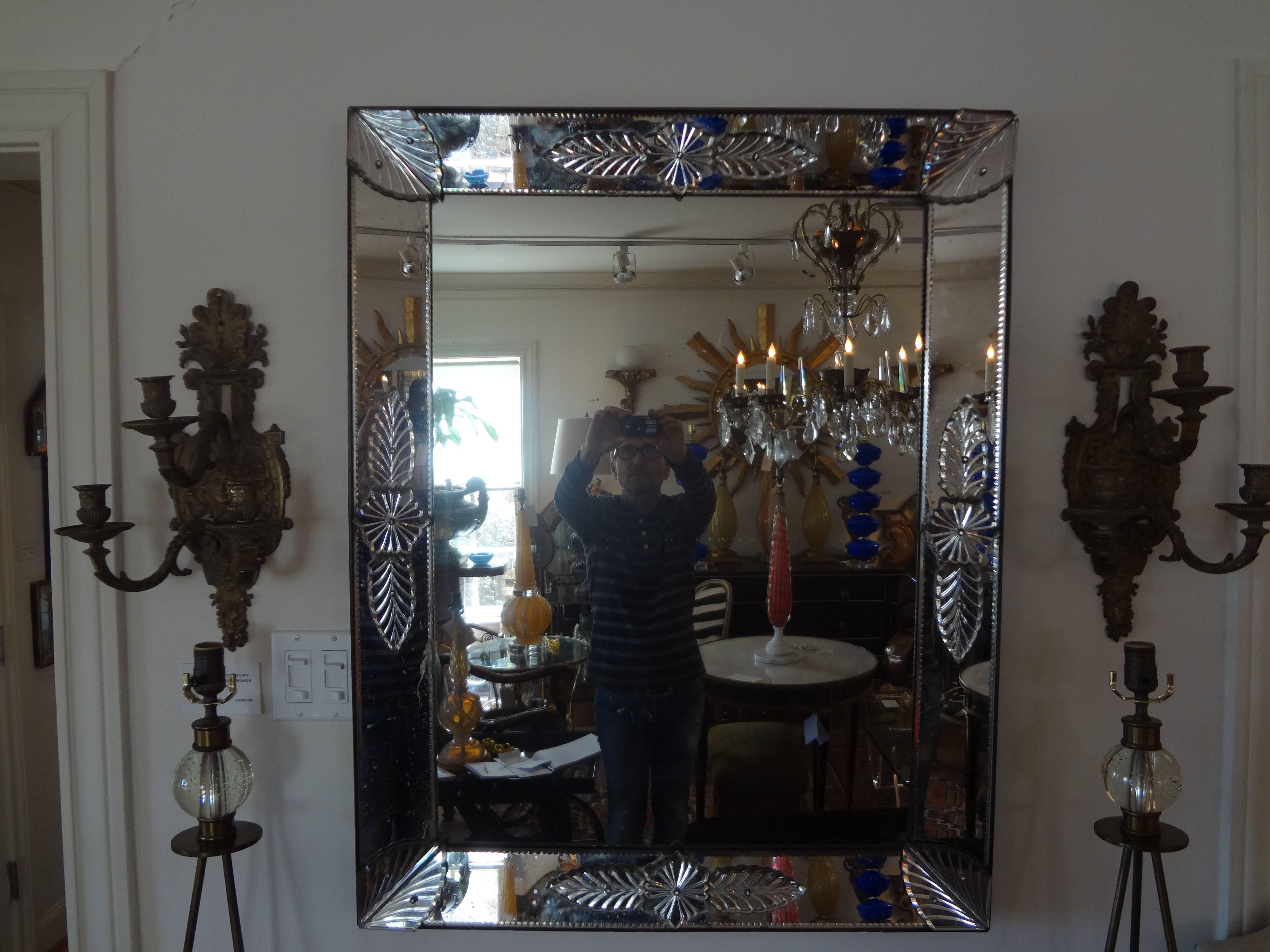 Louis XVI style Venetian mirror.
19th century Italian Venetian mirror that can be hung vertically or horizontally. This unusual Venetian mirror is mercury glass and has some minor expected foxing. The majority of this foxing on the fabulous Louis