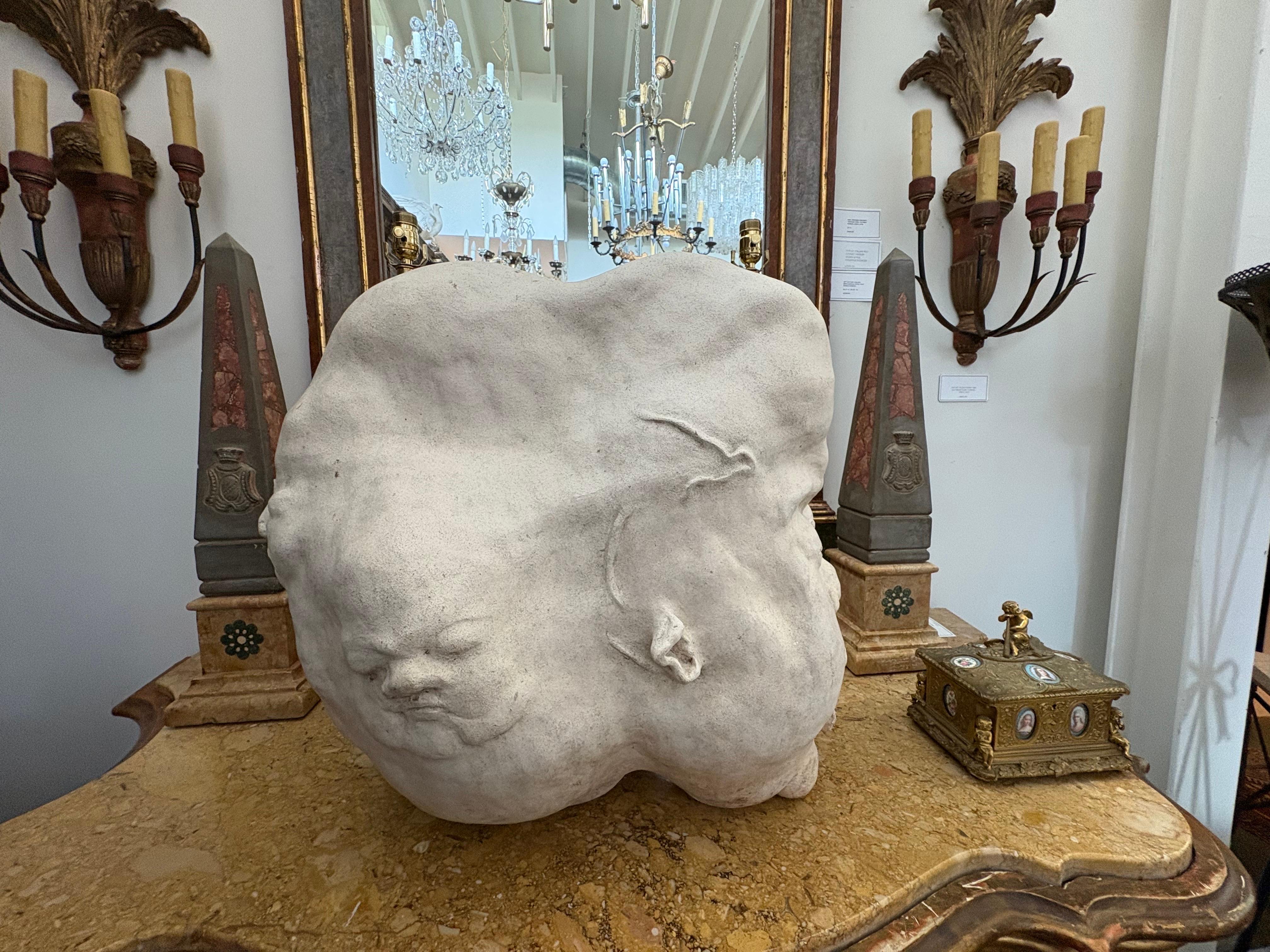 Surrealist Ceramic Face Sculpture.
Offered is an unusual textured ceramic sculpture in the Surrealist style. This shapely abstract surrealist sculpture has many faces on it and appears completely different from every angle.
Beautifully displayed on