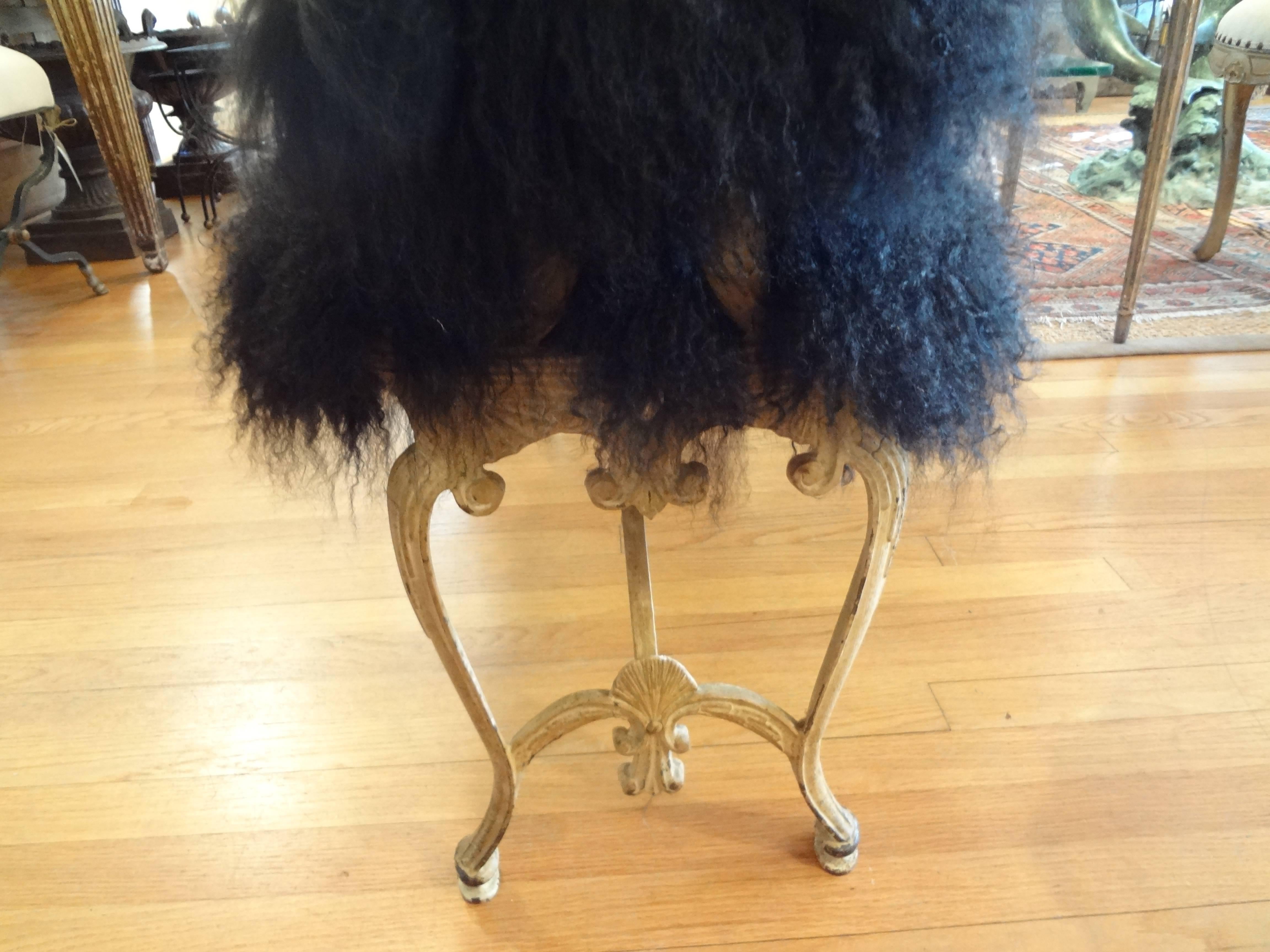 Desirable distressed iron bench newly upholstered in black Mongolian lambs wool.

Please click KIRBY ANTIQUES logo below to view additional pieces from our vast inventory.
 