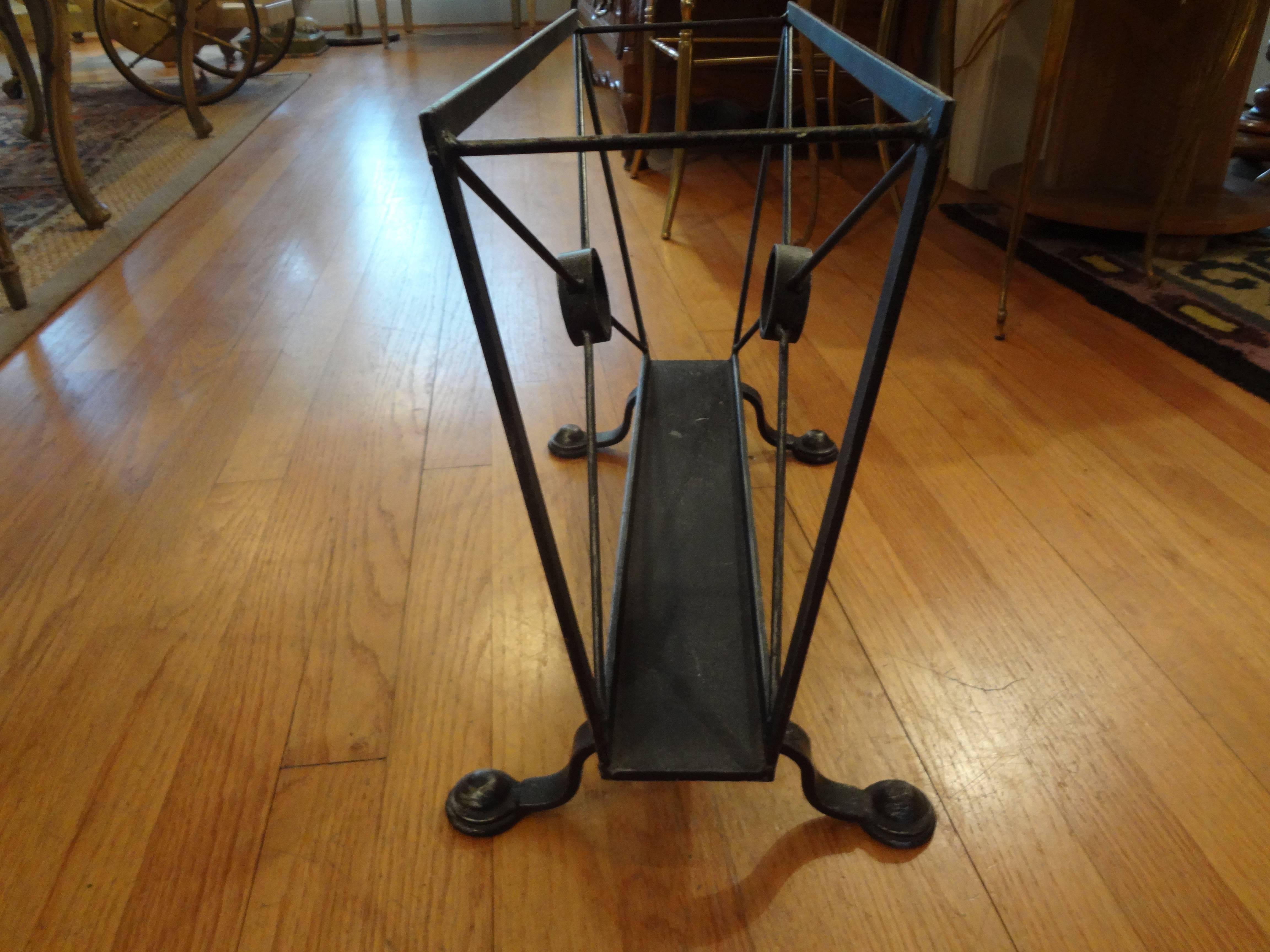 Simple yet Classic hand-forged wrought iron magazine rack after Tommi Parzinger.

Please click KIRBY ANTIQUES logo below to view additional pieces from our vast inventory.

 