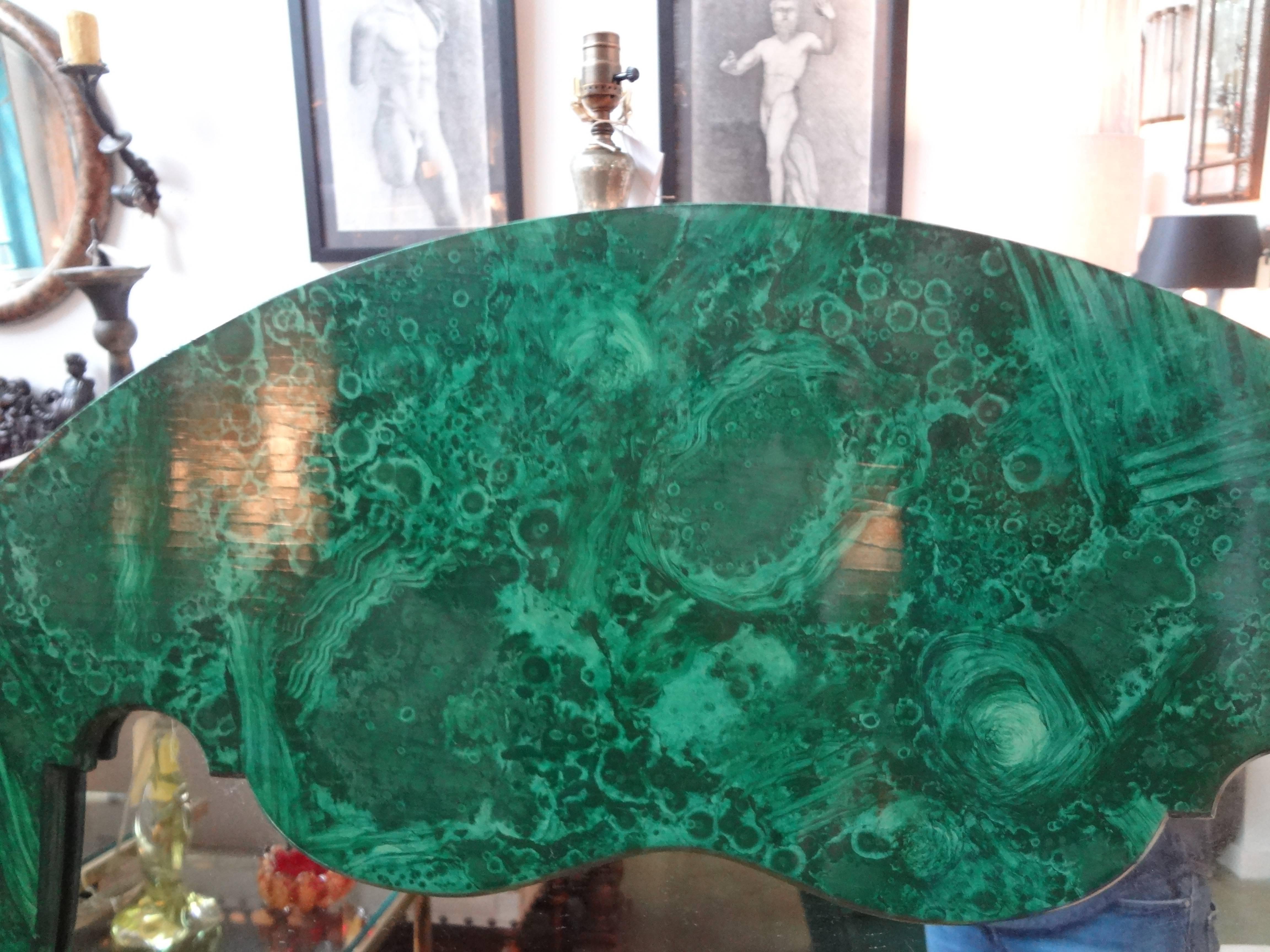 Stunning Italian Hollywood Regency faux malachite lacquered wood mirror.
This vintage Italian mirror with its hand decorated faux malachite finish is very realistic looking and dates to the 1960s.

 