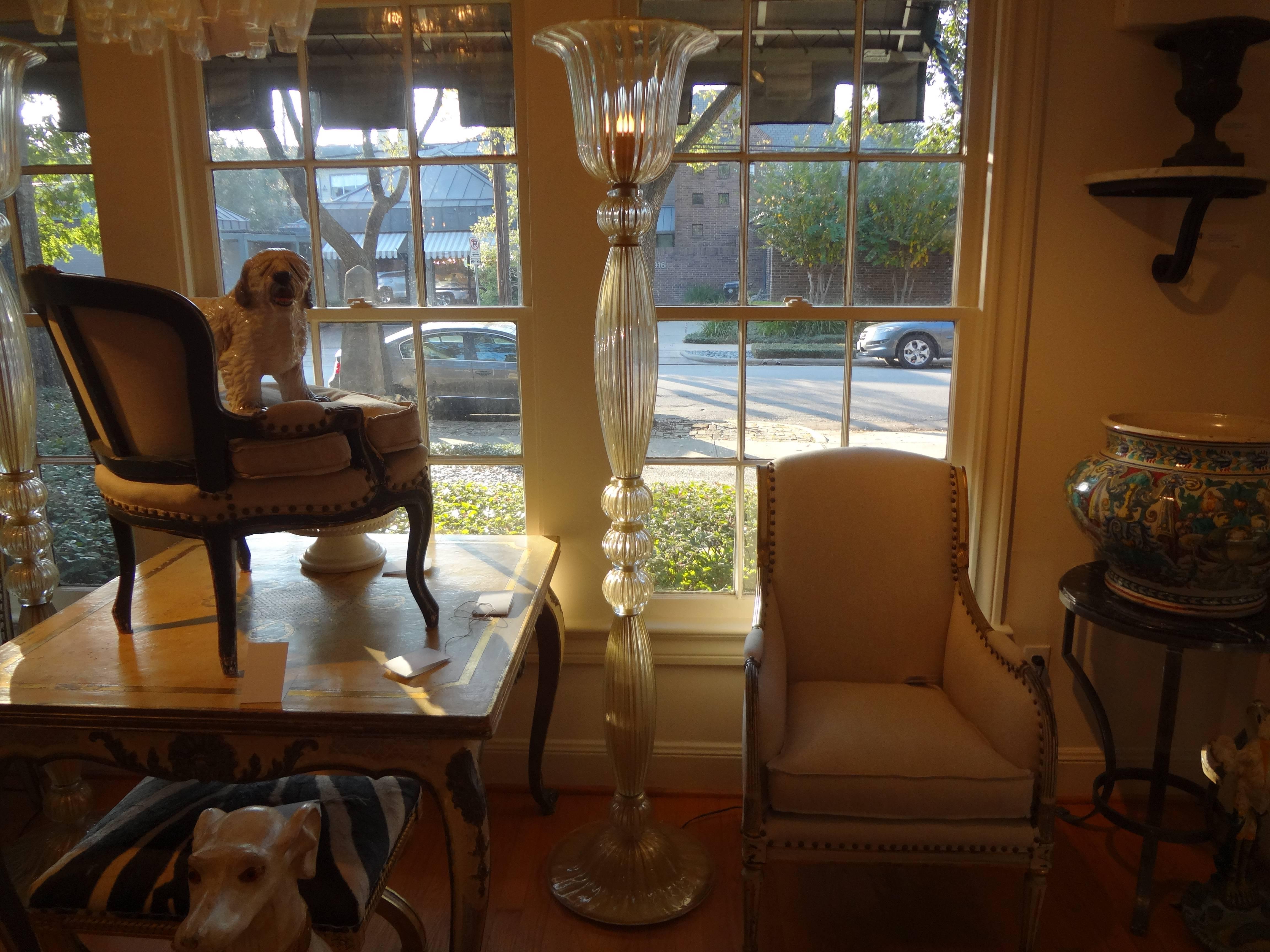 Matching pair of blown Murano glass torchiere form floor lamps by Barovier.
Clear glass with gold flecks throughout.
Perfect condition.

Please click KIRBY ANTIQUES logo below to view additional pieces from our vast inventory.

 