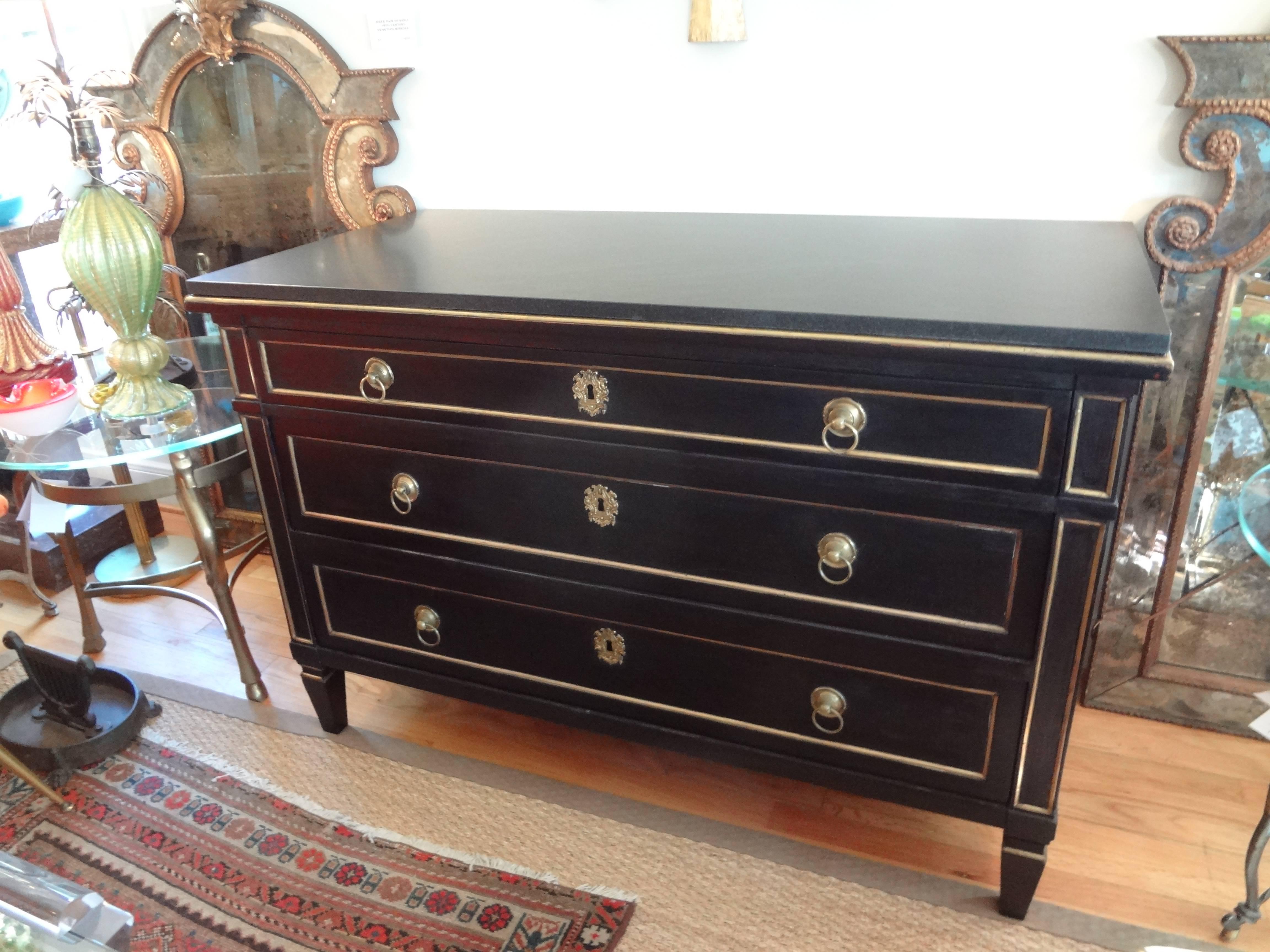 Handsome period French Louis XVI ebonized three-drawer commode/chest with bronze accents and a marble top.

 

 