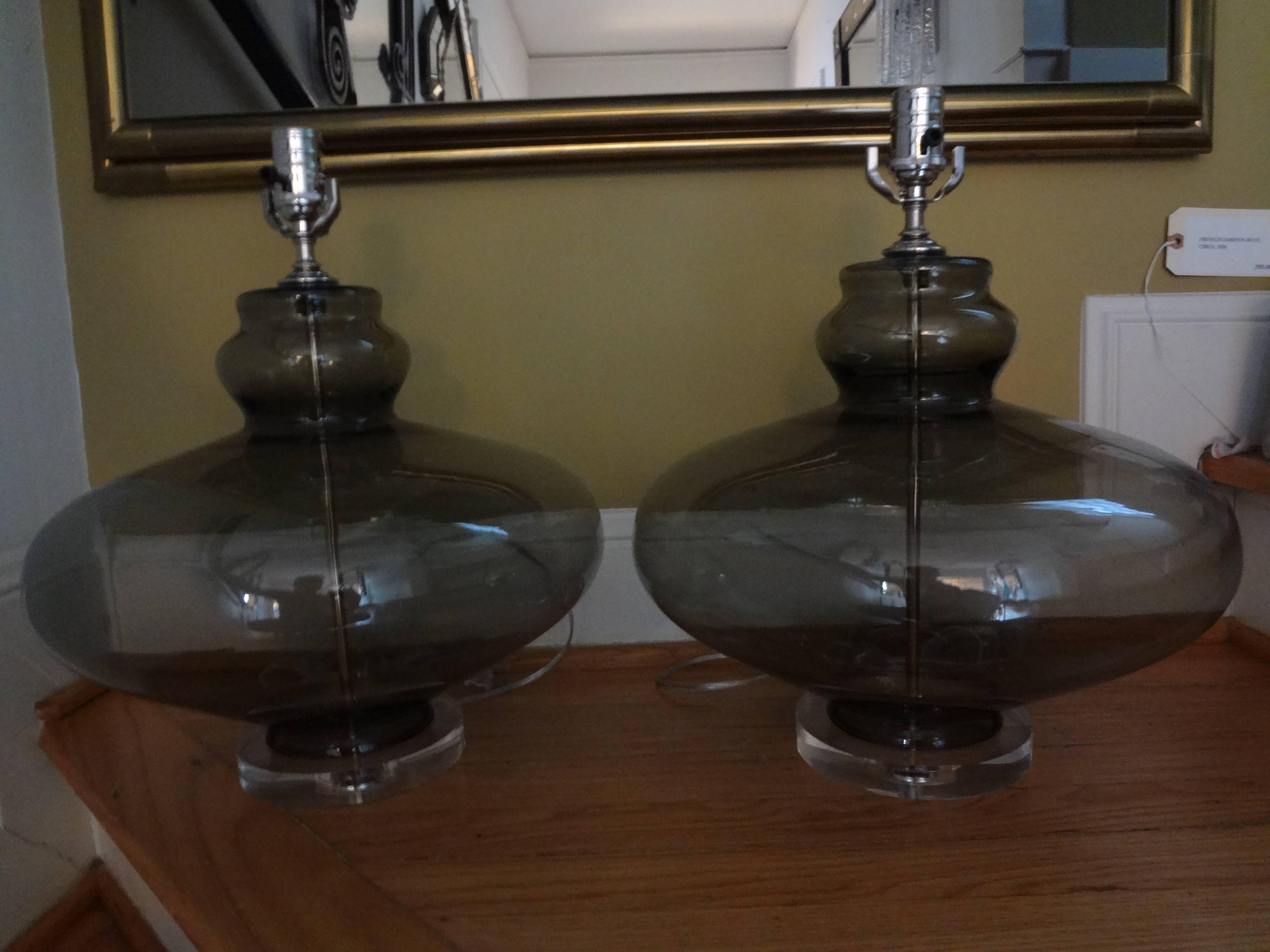 Sculptural pair of Hollywood Regency Italian blown smoked glass lamps on Lucite bases. These gray glass lamps have been newly wired for the U.S. market.

 