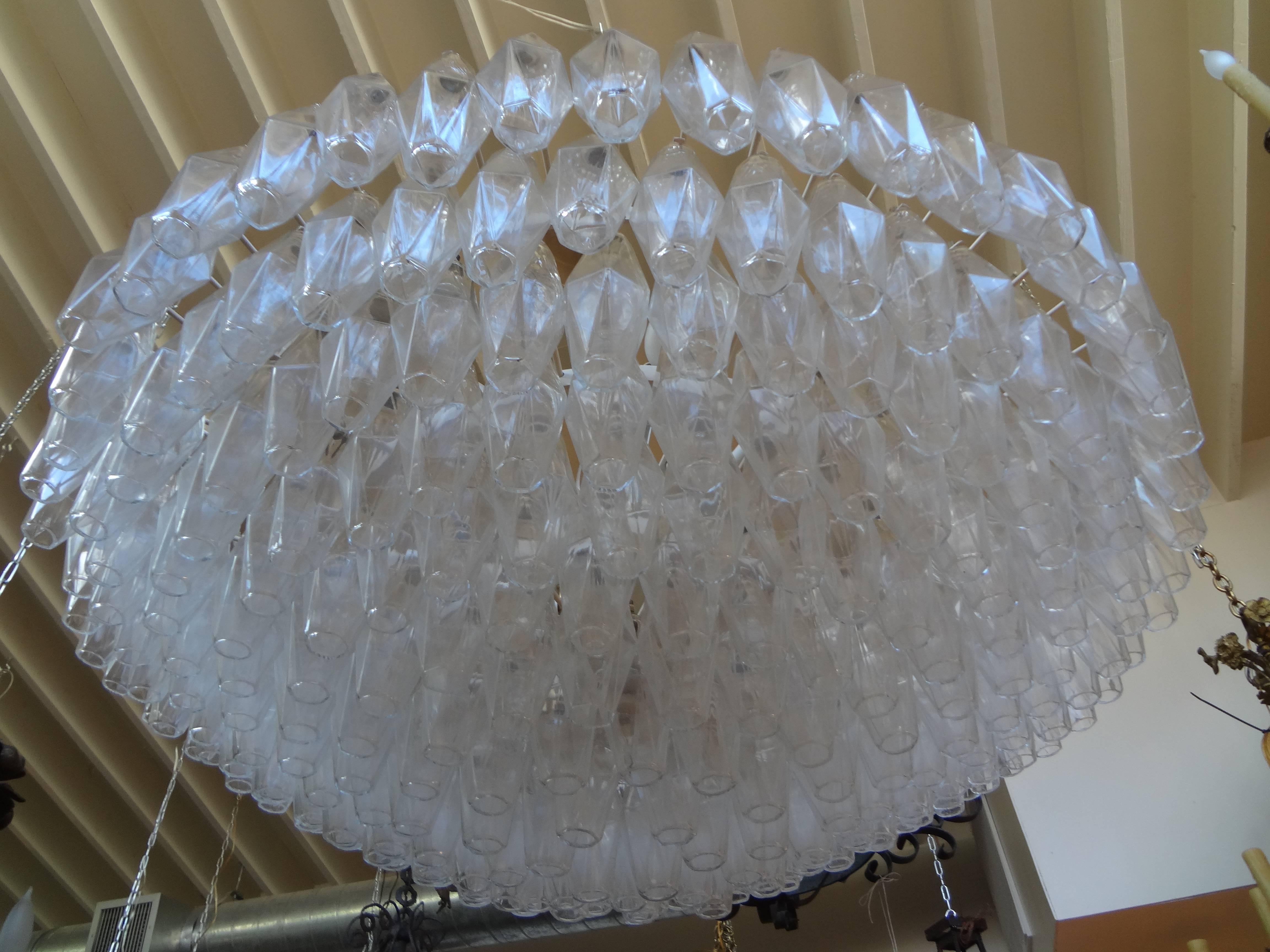 Chic Venini murano glass chandelier with individually hung hand blown polyhedron clear glass shades. This Murano chandelier is newly wired for the U.S. market.
Measures: Glass portion 43 inches D and 18 inches H.
Includes original 40 inch heavy