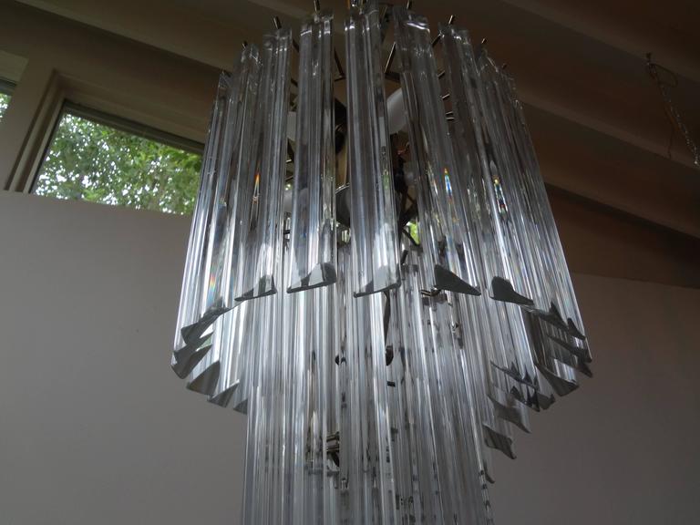 Italian mid-century Murano Venini style glass spiral chandelier with clear prisms on a chrome structure. This murano chandelier is newly wired for US market. This murano glass lantern or chandelier can be flush mounted for use in homes with limited