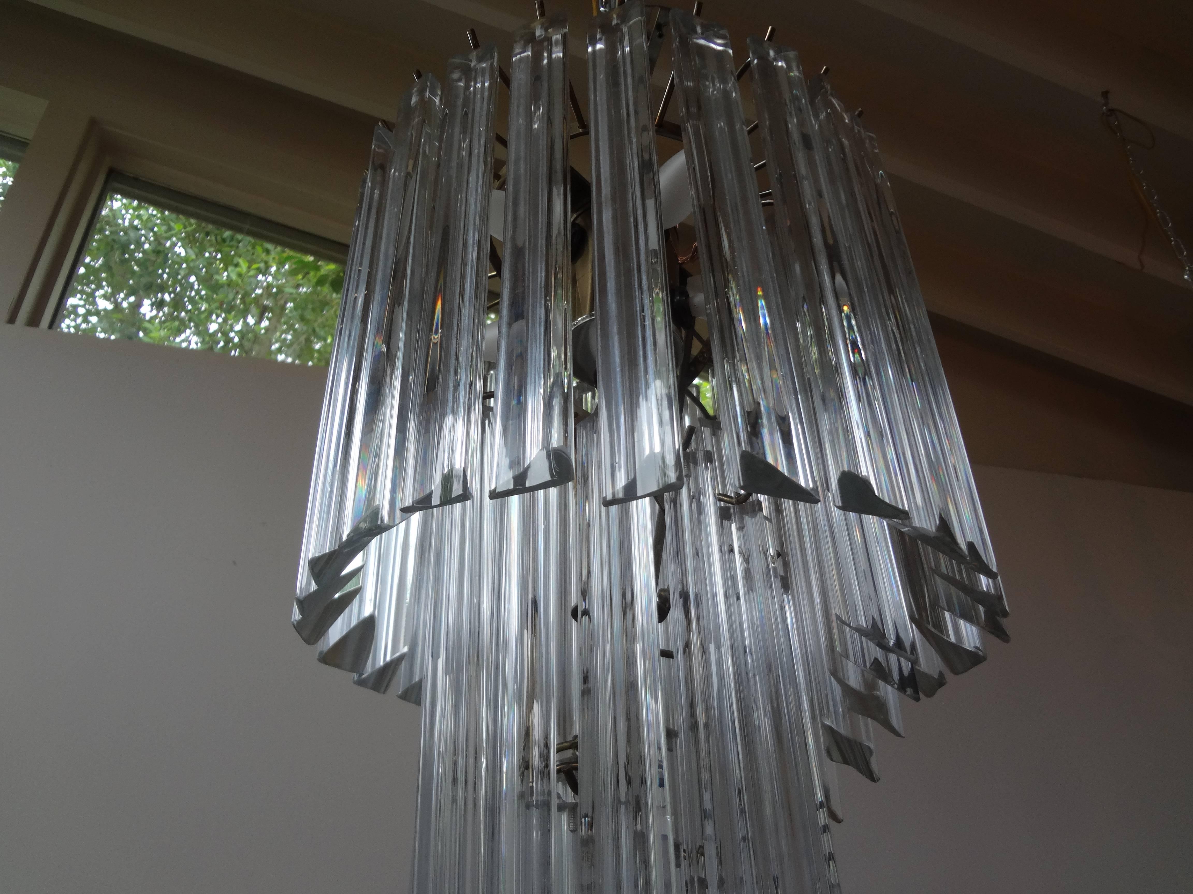 Venini inspired Murano spiral chandelier.
Italian midcentury Murano Venini style glass spiral chandelier with clear prisms on a chrome structure. This Murano chandelier is newly wired for US market. This Murano glass lantern, pendant or chandelier