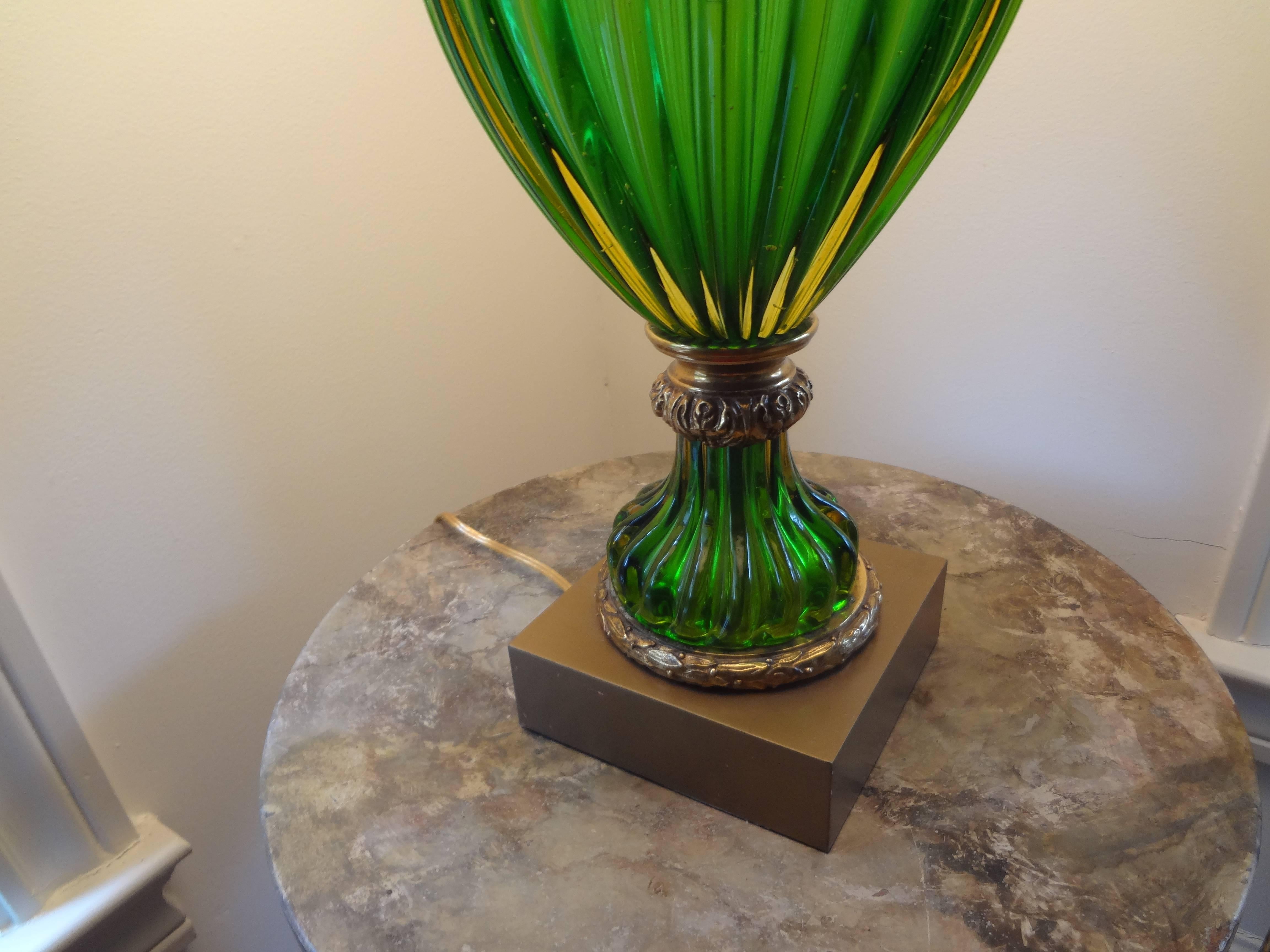 Stately Italian green blown and ribbed Venetian glass lamp on gilt metal base, newly wired for U.S. market.
Measures: Height 36.5