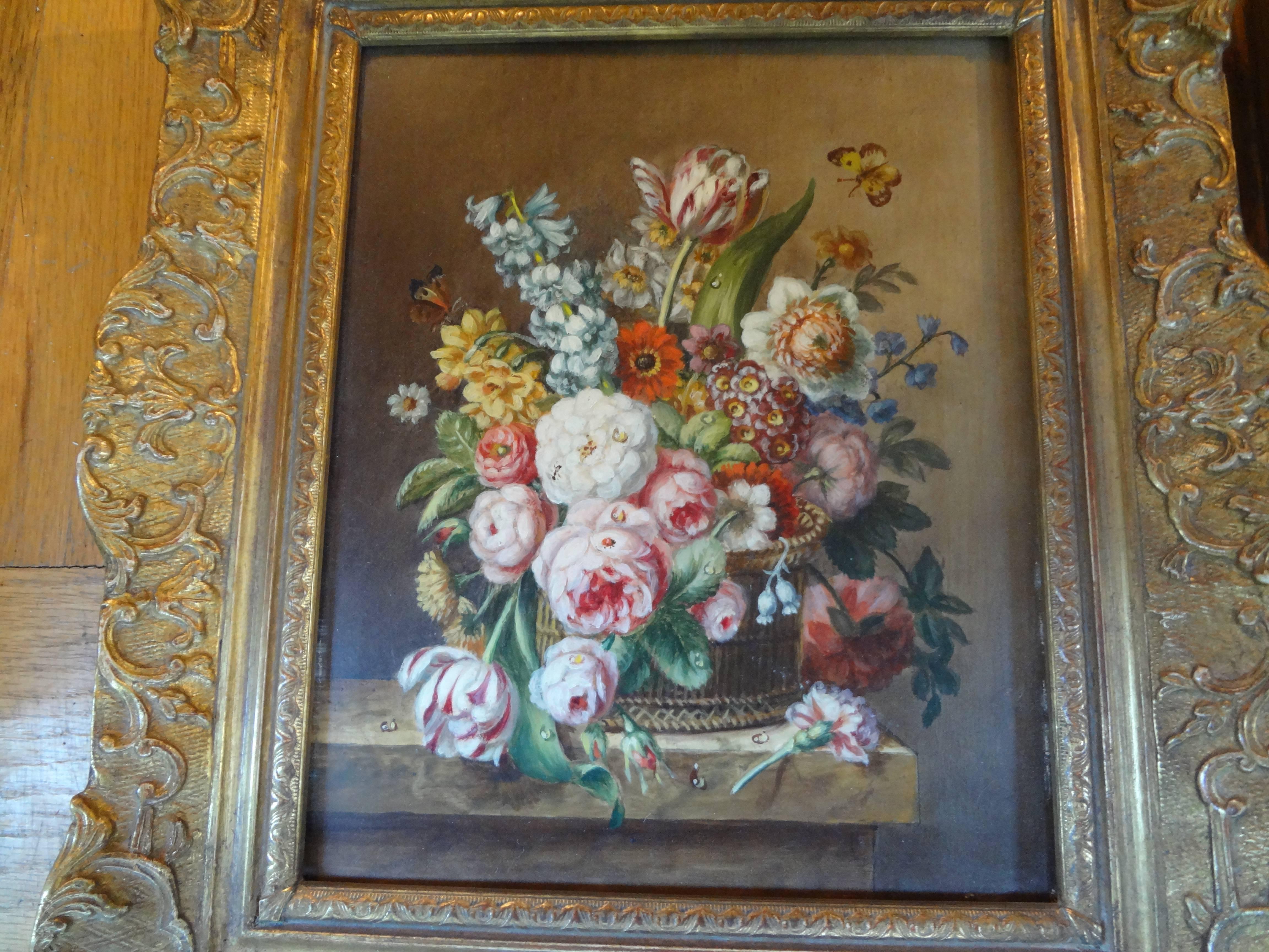 Pair of antique French framed floral oil paintings.
Well executed pair of antique French floral oil paintings on wood in giltwood frames, circa 1920 or earlier. These beautiful 18th century style complimentary decorative antique oil paintings are in