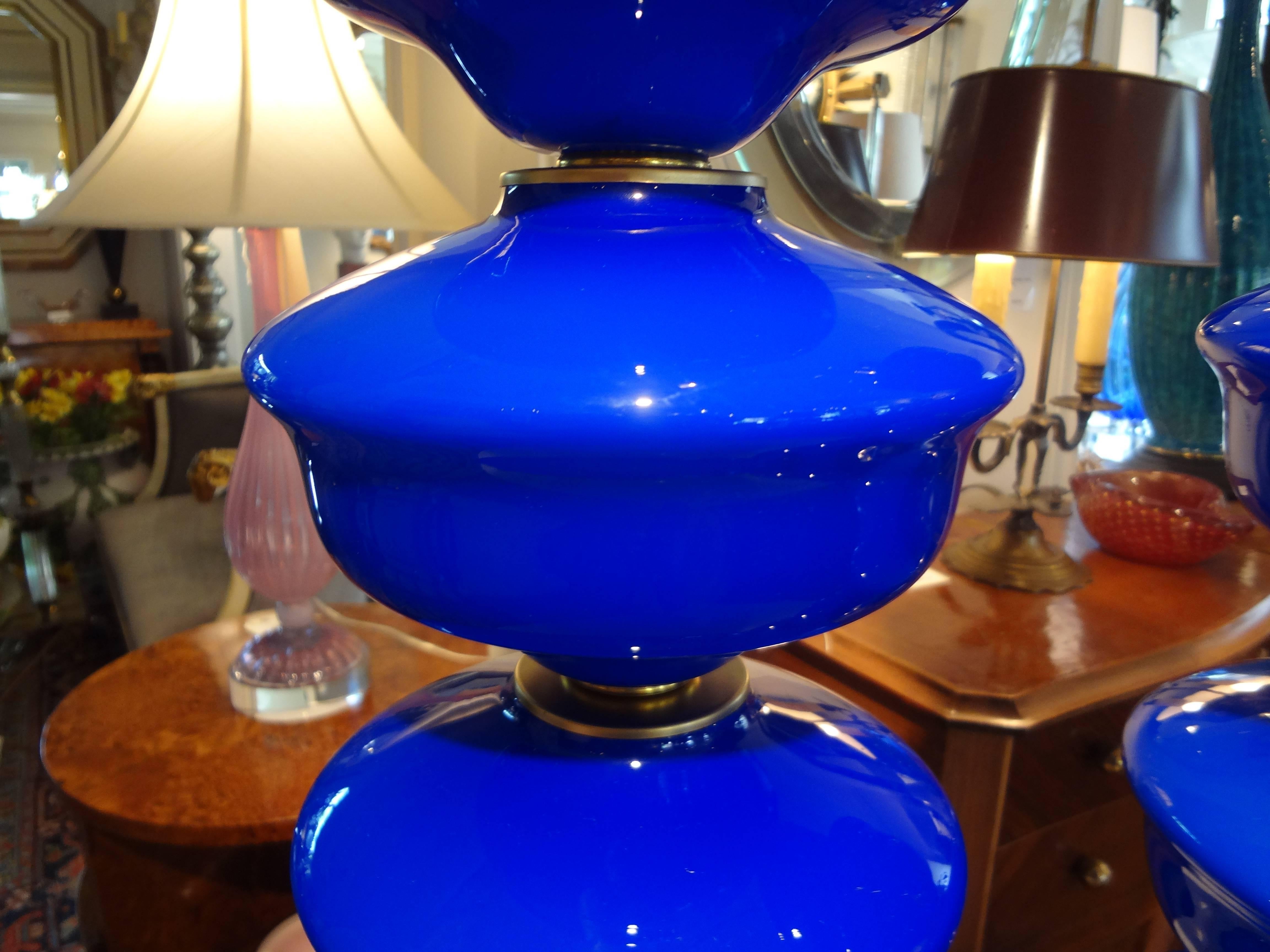 Great pair of Mid-Century Modern Italian cobalt blue Murano glass table lamps mounted on Lucite bases, newly wired with brass fittings for U.S. market.

Please click KIRBY ANTIQUES logo below to view additional pieces from our vast inventory.