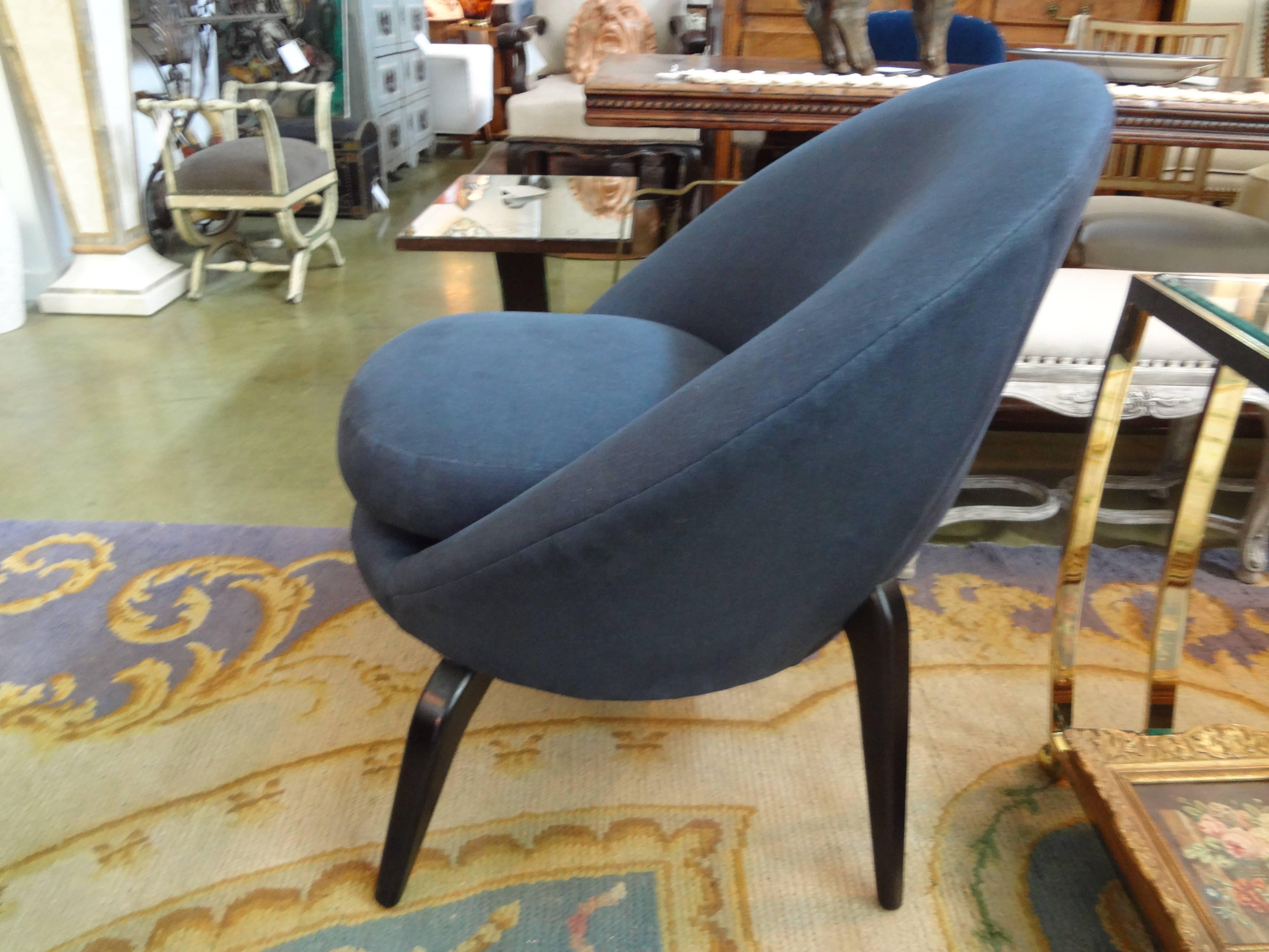 Fabulous French Mid-Century Modern chair with exaggerated legs in the manner of Jean Royère. Taken down to frame and professionally reupholstered in blue linen.

Please click 