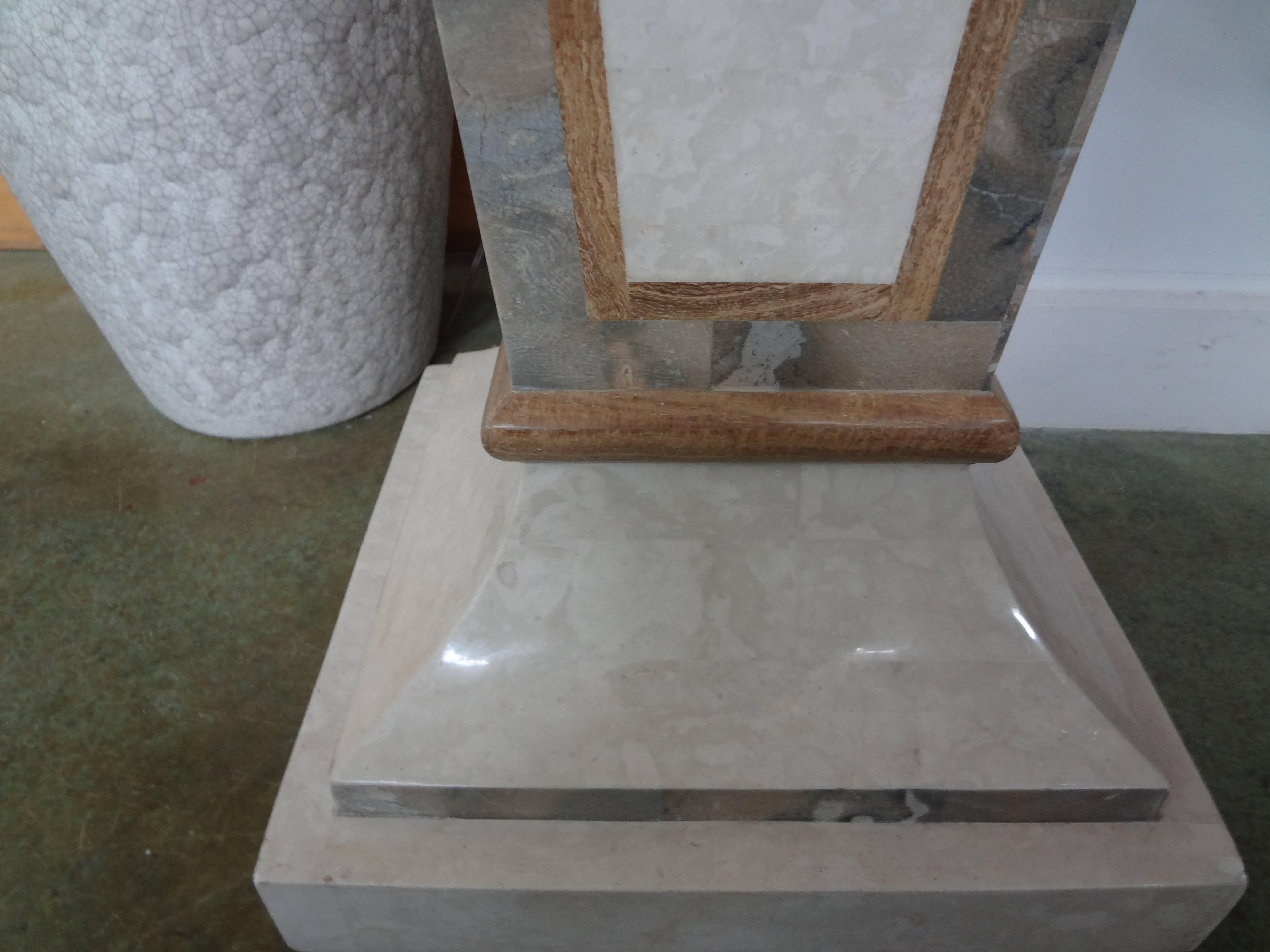 Large tessellated stone Art Deco style geometric pedestal, possibly Maitland-Smith.
This Hollywood Regency pedestal would work well in a variety of interiors to display a sculpture, bust or as a plant stand.
Top dimensions: 11 inches x 11