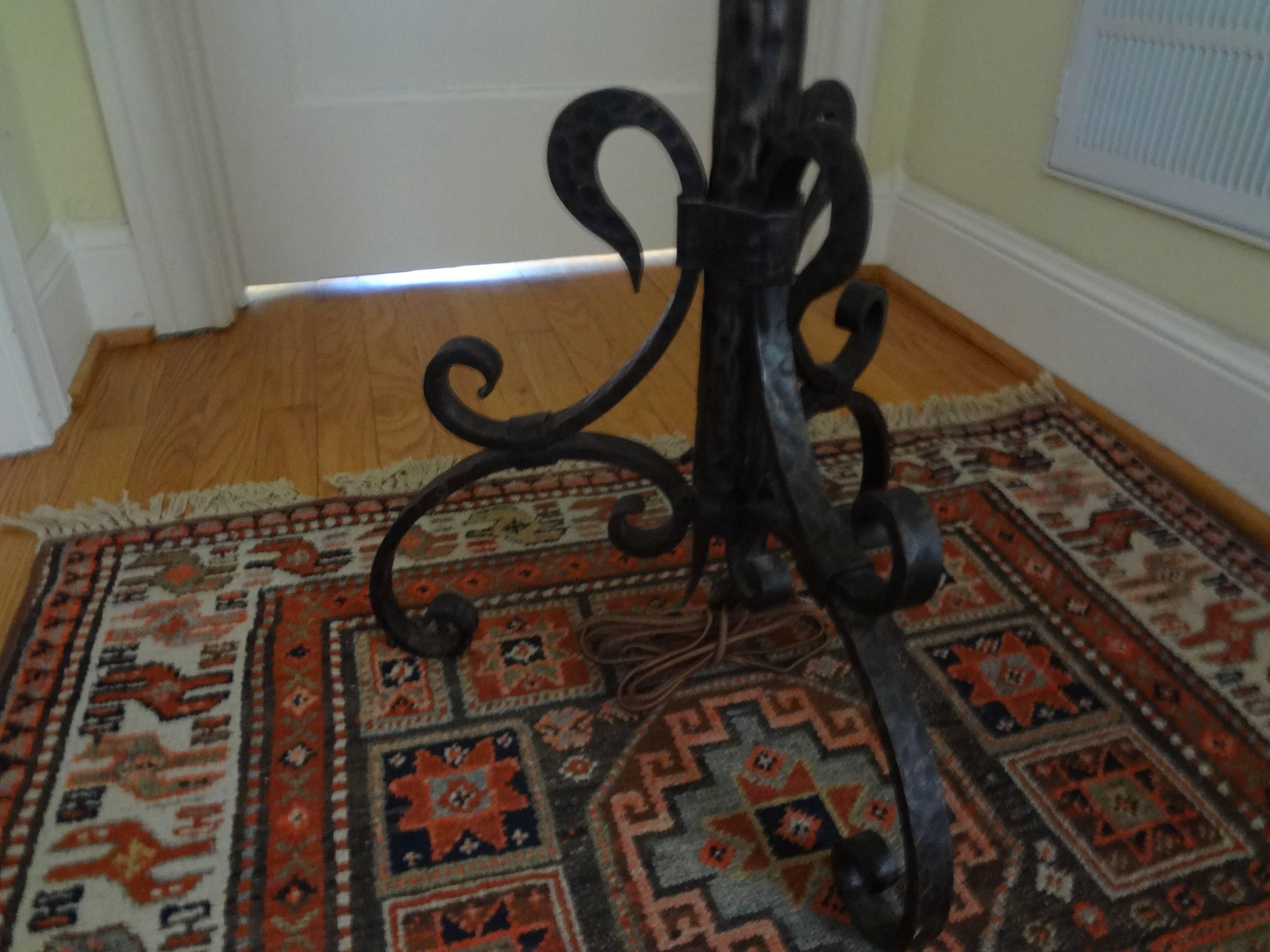 Pair of French wrought iron floor lamps inspired by Gilbert Poillerat.
Chic matched pair of French Art Deco hand forged wrought iron standing lamps newly wired for U.S. market. This great pair of French wrought iron floor lamps are in the style of