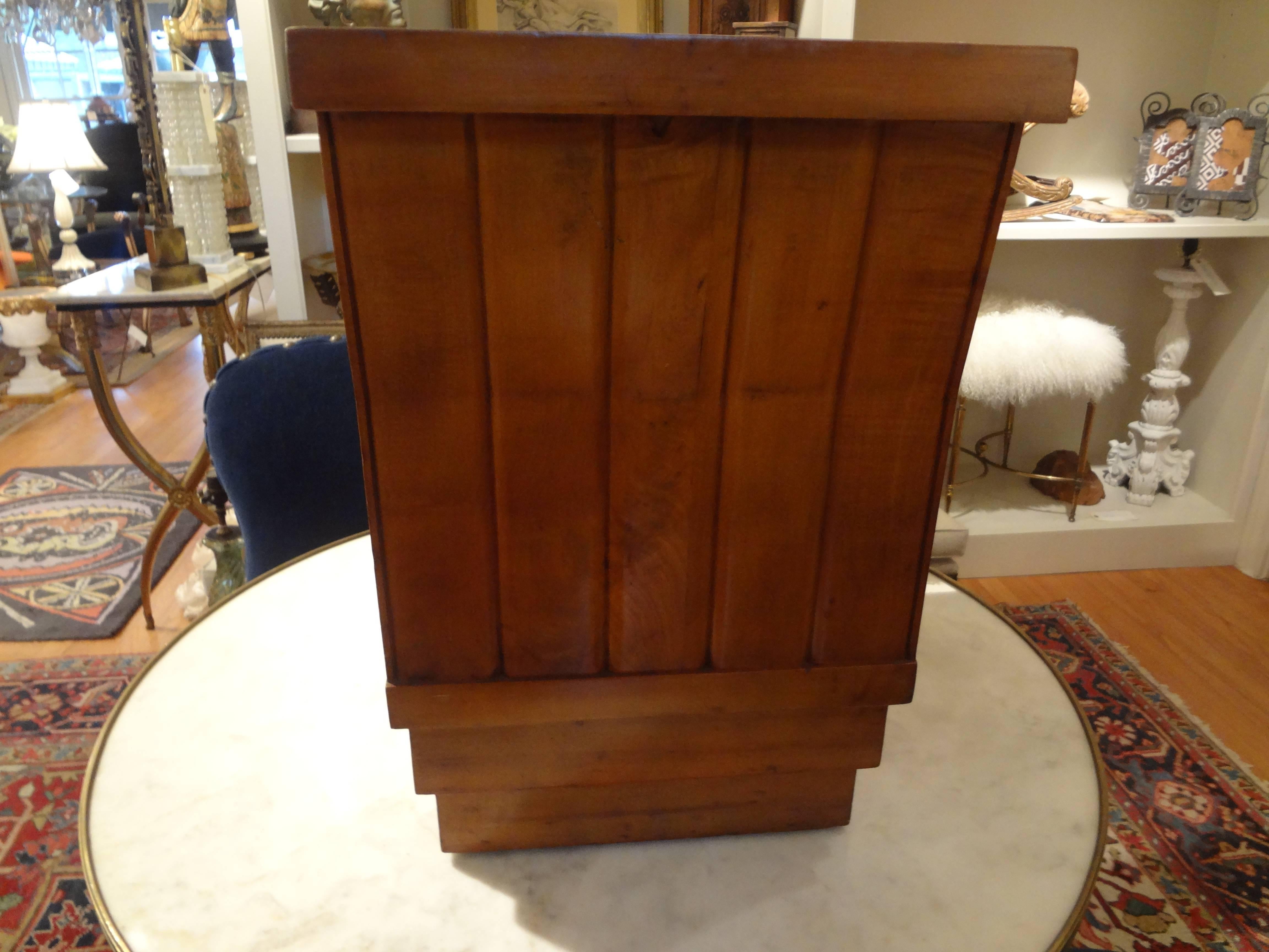 Period French Art Deco geometric bench, stool or ottoman newly upholstered in leather with brass nailhead detail. This gorgeous Jules Leleu inspired fruitwood bench, circa 1925 would work well as a vanity bench, in a hall or extra seating where