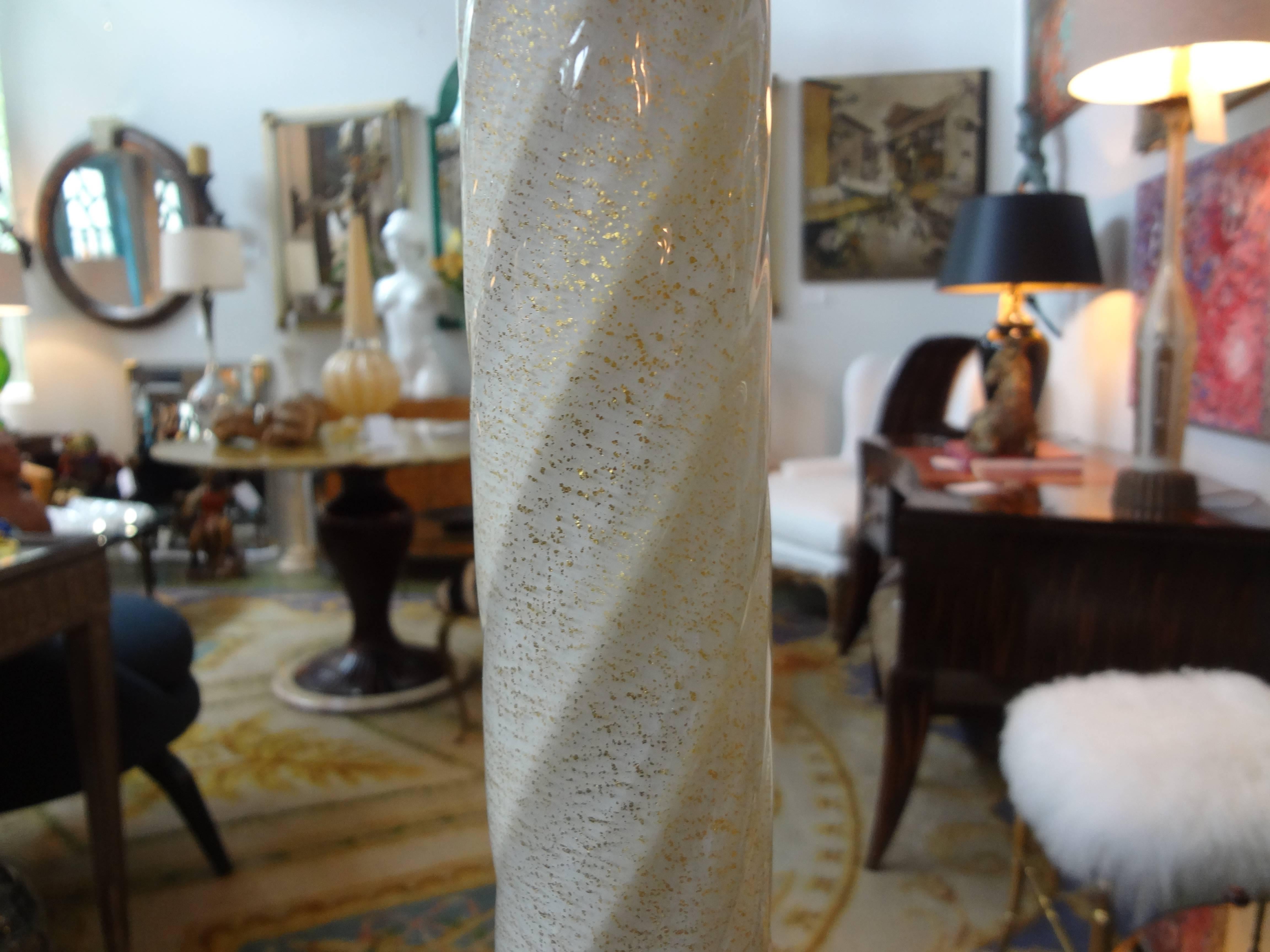 
Unusual white Italian infused with gold Murano glass floor lamp on bronze base trimmed in gold Murano glass.  This fabulous Venetian Glass floor lamp was designed by Barovier. Newly wired for U.S. Market, circa 1940.