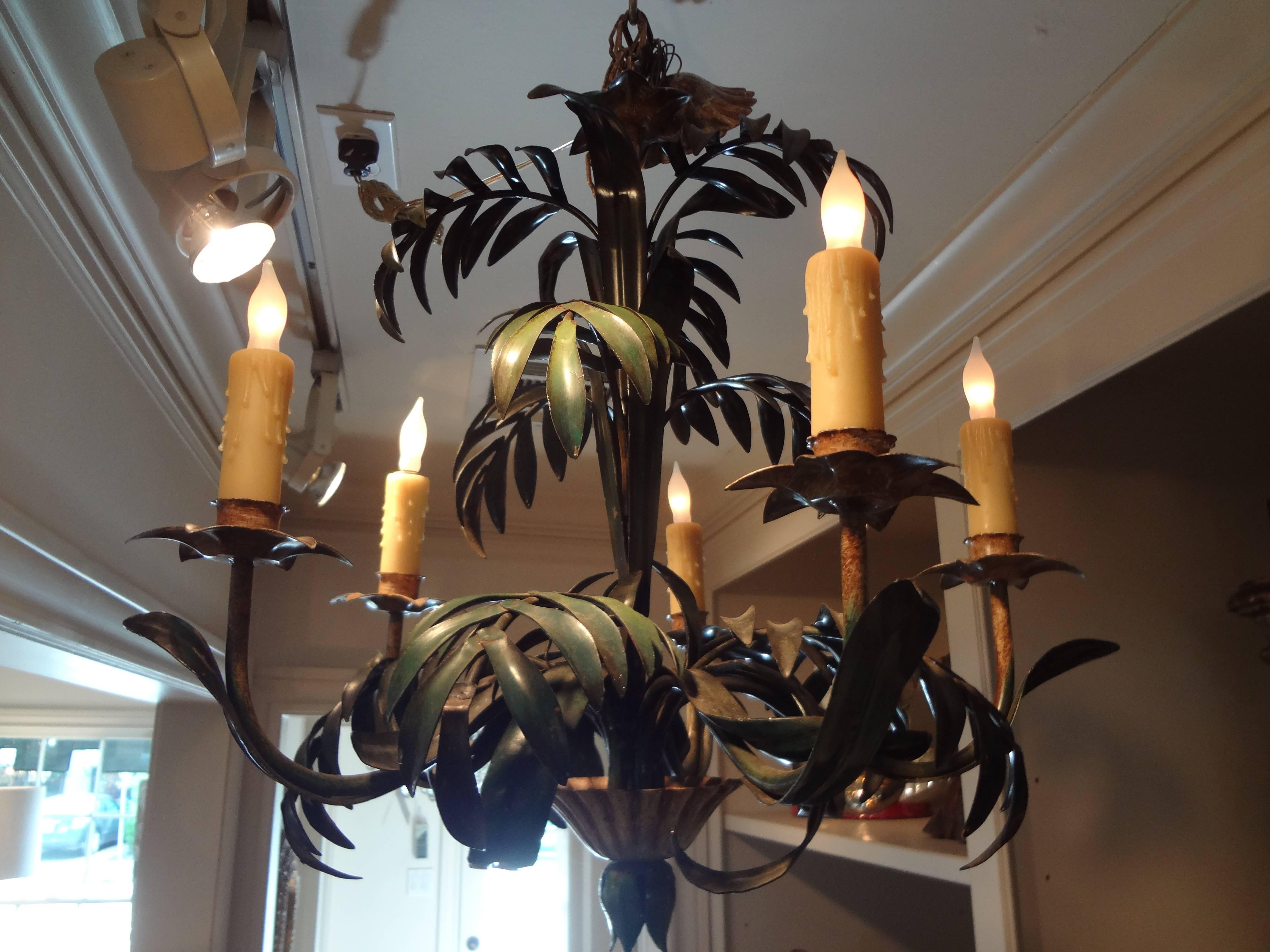An Italian, Hollywood Regency painted tole five-light palm frond chandelier with original canopy, circa 1960. Newly wired with polywax candle sleeves.
   