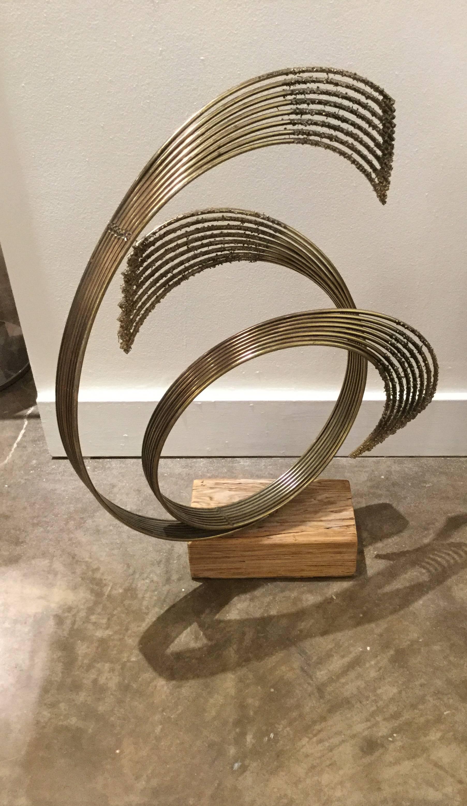 Signed Curtis Jere Windswept brass sculpture on an unusual wooden base. This kinetic sculpture rotates to other positions.
Base dimensions:
11 inches wide
6.13 inches deep.
 
 
Curtis Jere Brass Sculpture On An Unusual Wooden Base, Circa.