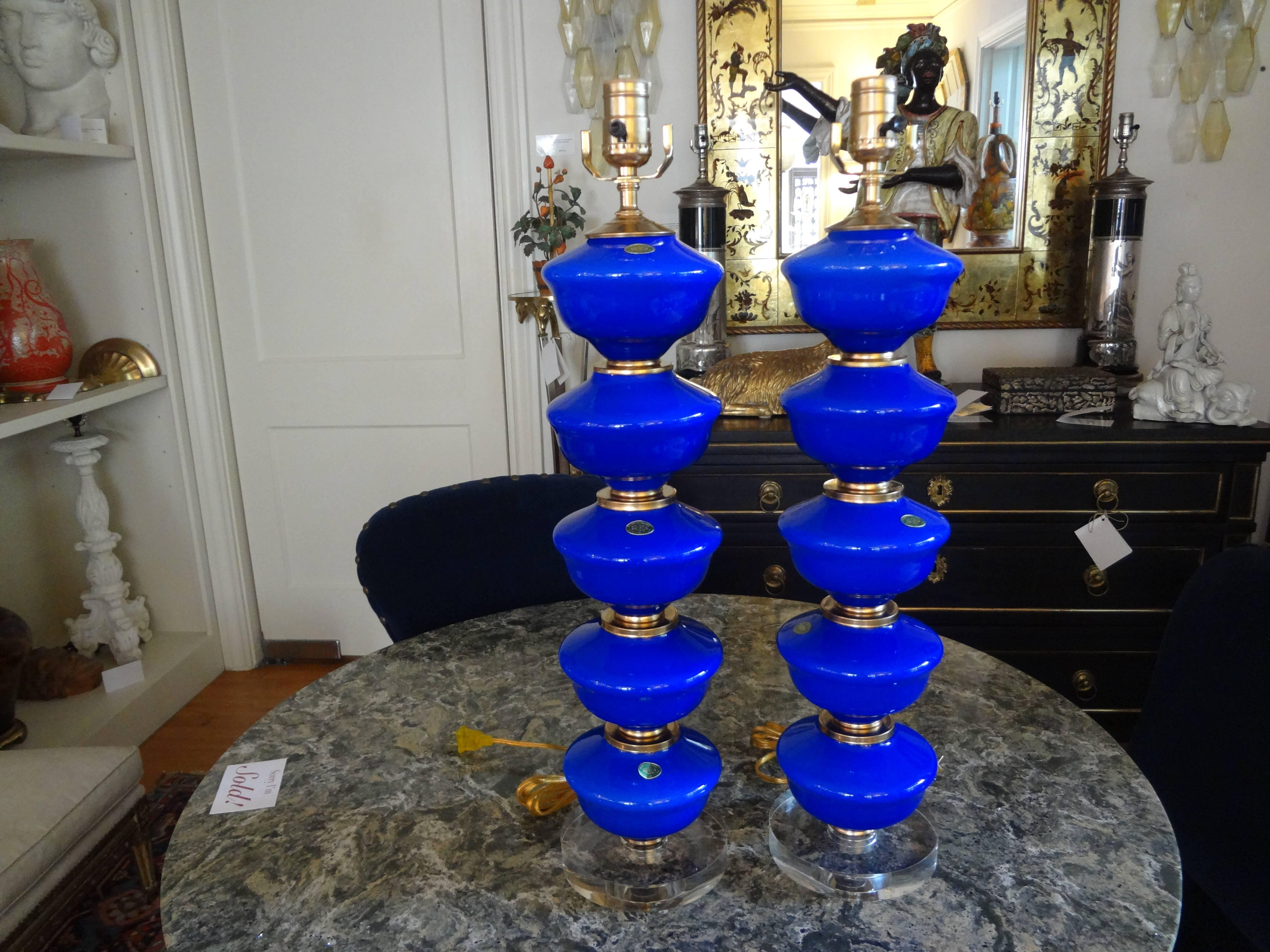 Great pair of vintage midcentury cobalt blue stacked ball Venetian glass lamps, circa 1960. Each sphere is separated with brass fittings. These stunning Italian table lamps are mounted on Lucite bases and are newly wired for the U.S. Market. Retain