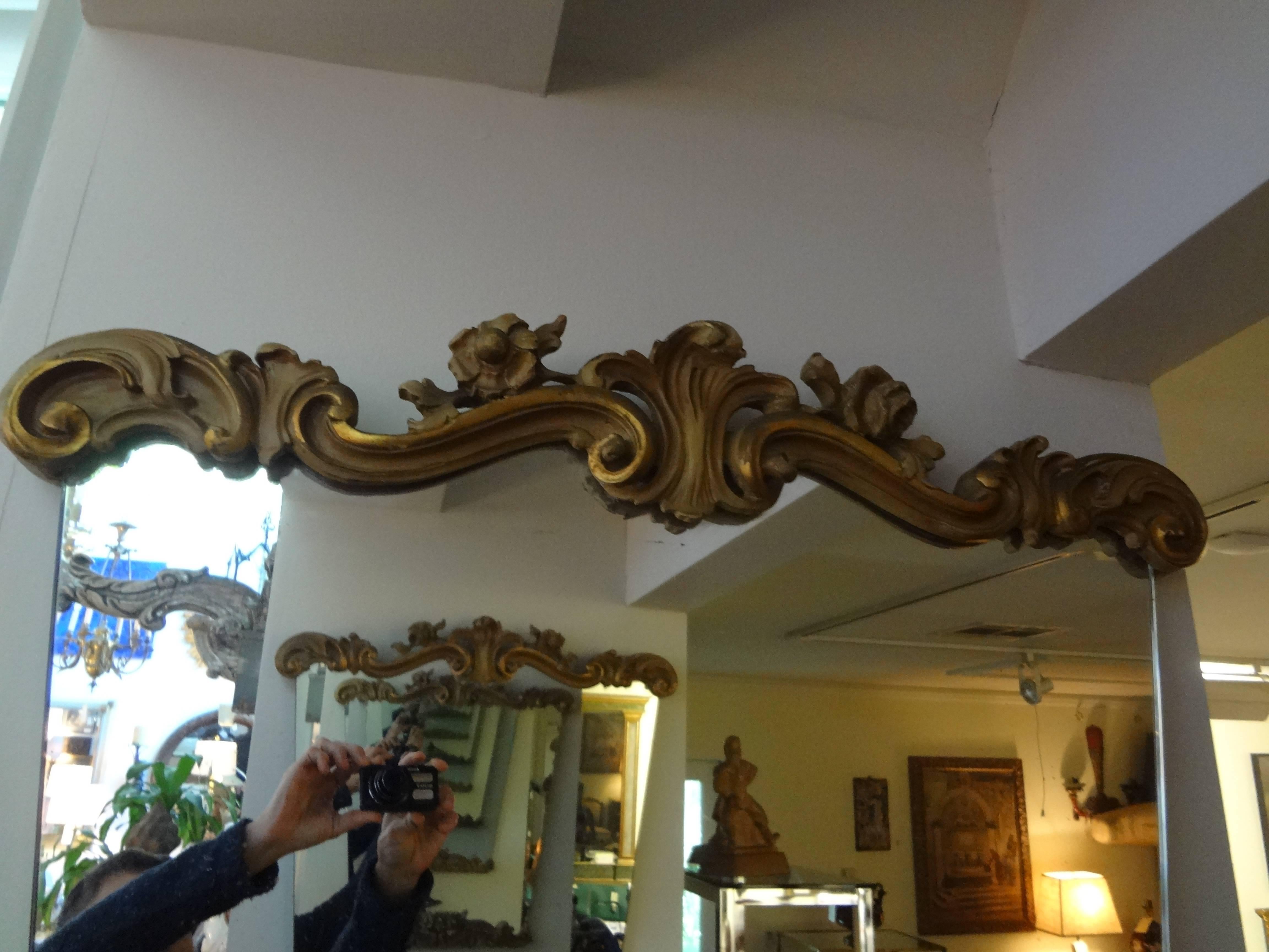 Stunning pair of painted and giltwood mirrors-Italian Serge Roche or Dorothy Draper inspired, circa 1940s. These fabulous gilt wood mirrors would look great above consoles, credenzas, commodes, chests or buffets.