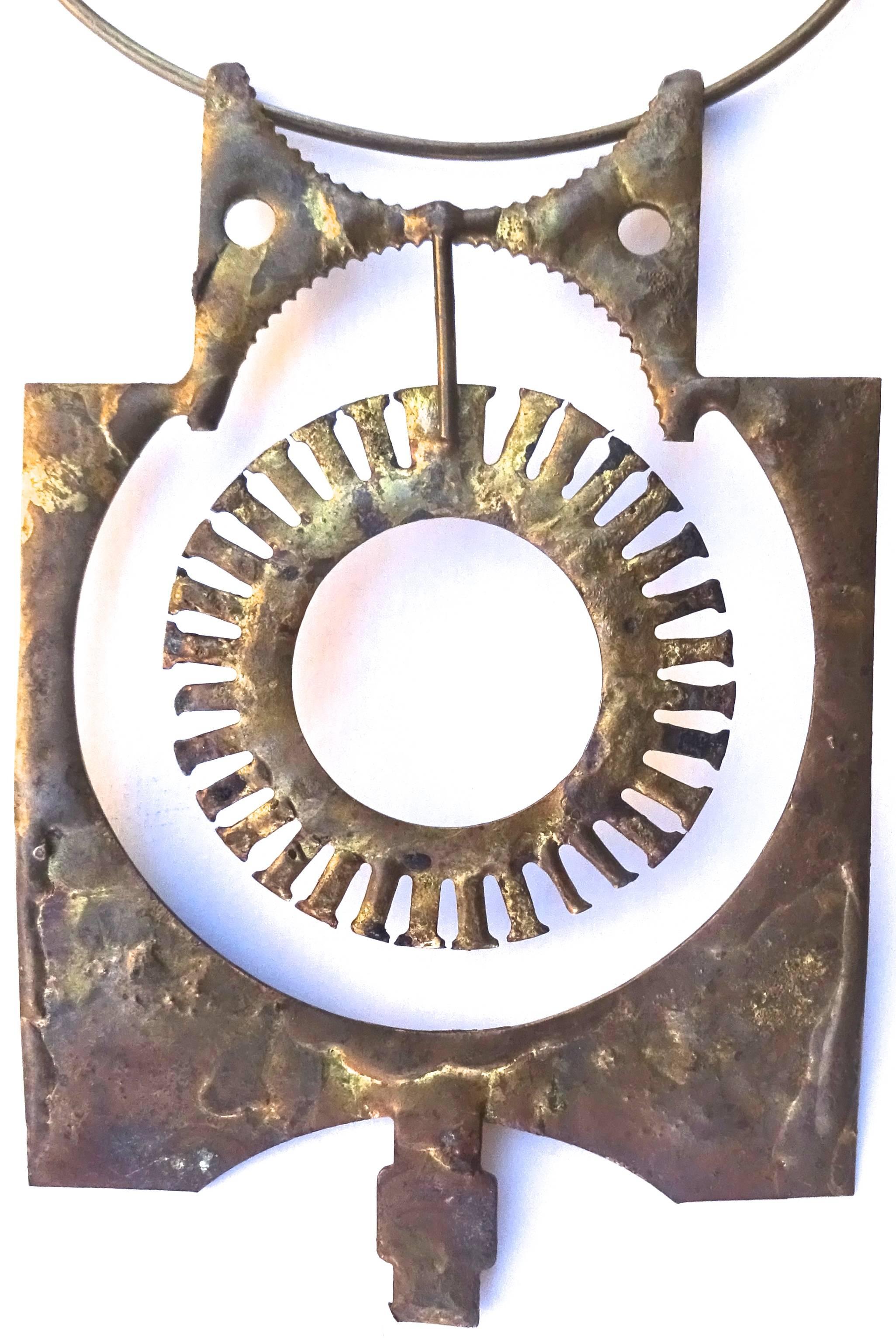 Large Brutalist 1970s hand-wrought studio brass pendant.

Overall dimensions with brass choker ring: 11