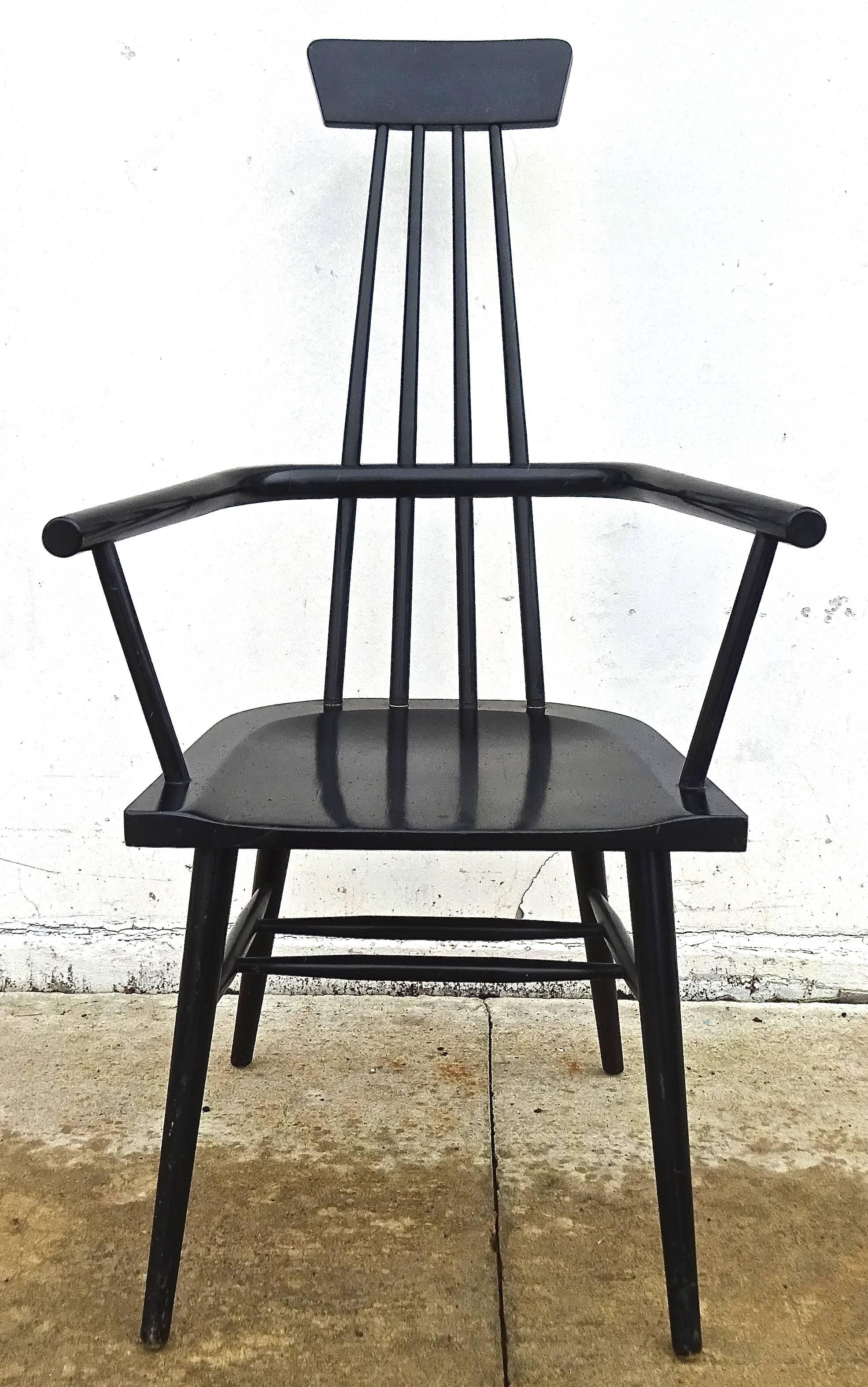 Great modernist windsor chair designed in the 1950s by Paul McCobb with black lacquered finish. Exaggerated tall scale, and extremely comfortable, this chair would make an excellent desk chair, or an occasional pull-up chair.