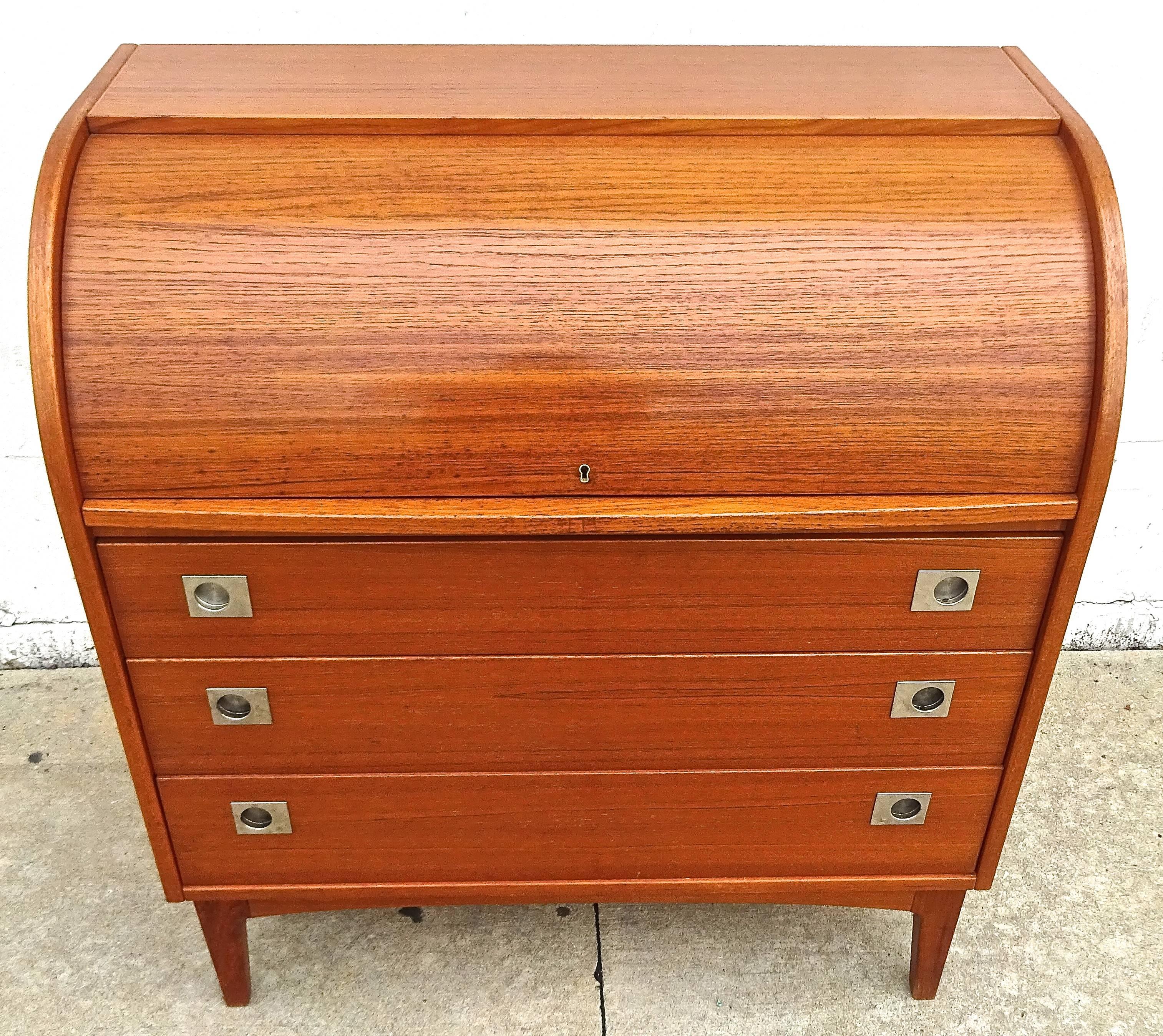 Chic Broderna Gustaffsons teak roll top secreatary with chest of drawers with, designed in the 1960s in Sweden. 

This model features rare never before seen polished aluminium recessed drawer handle hardware. 

A stylish and useful piece!