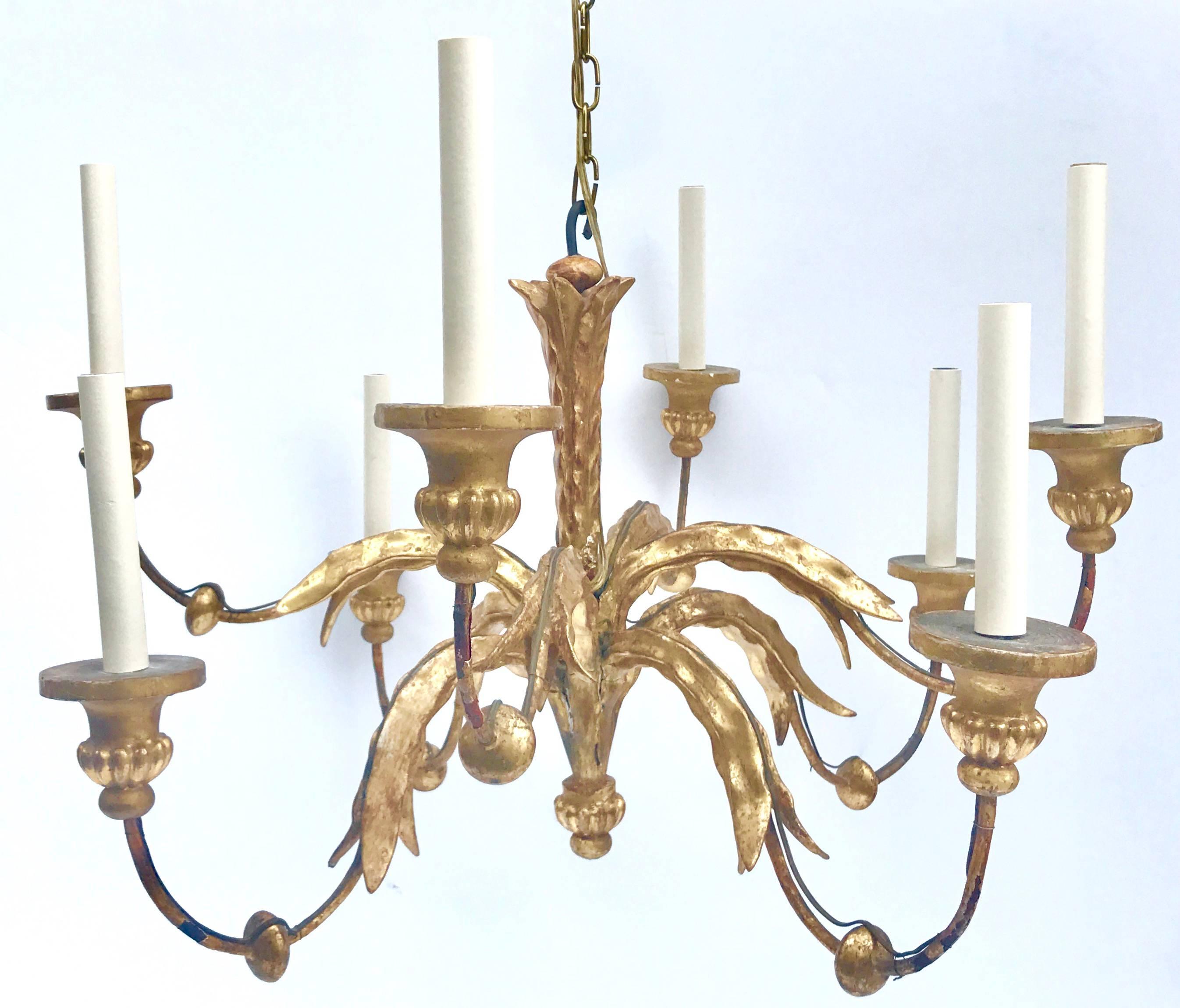 Fabulous late 19th century French water gilded wood and wrought iron eight-light chandelier.