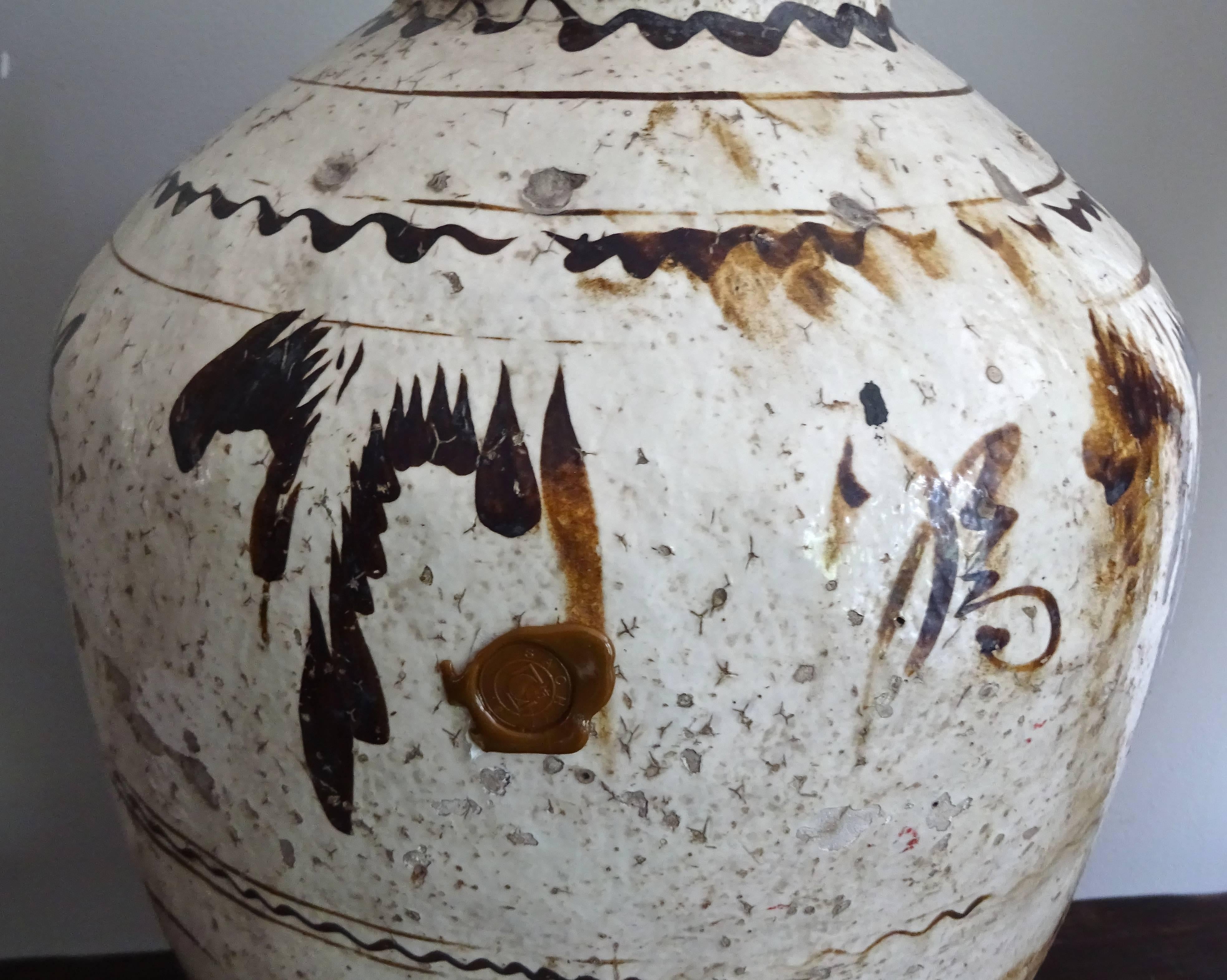 Chinese hand-painted, glazed ceramic wine vessel.