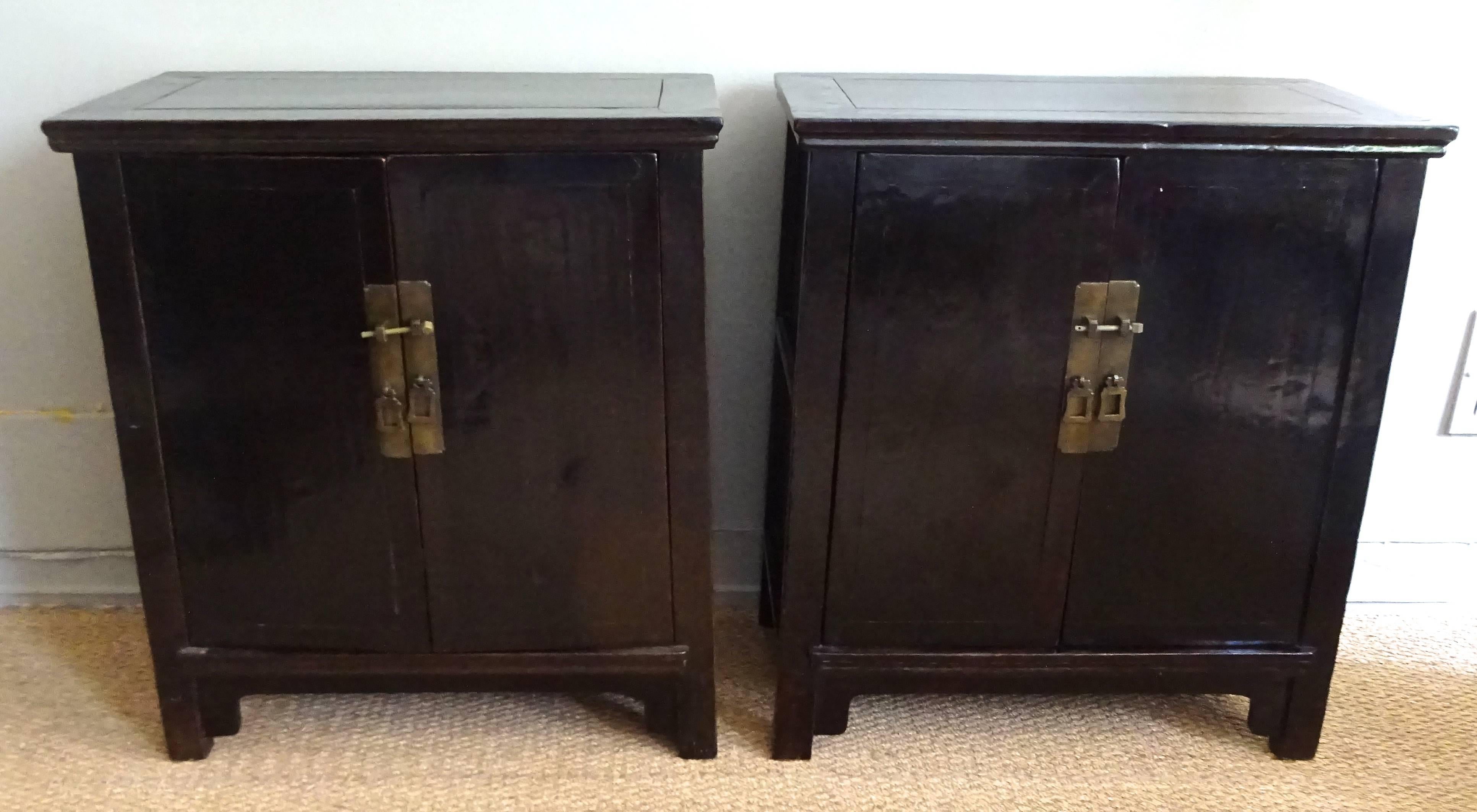 Elegant pair of low cabinets or bedside chests. Lacquered elm wood with mortise and tenon construction.