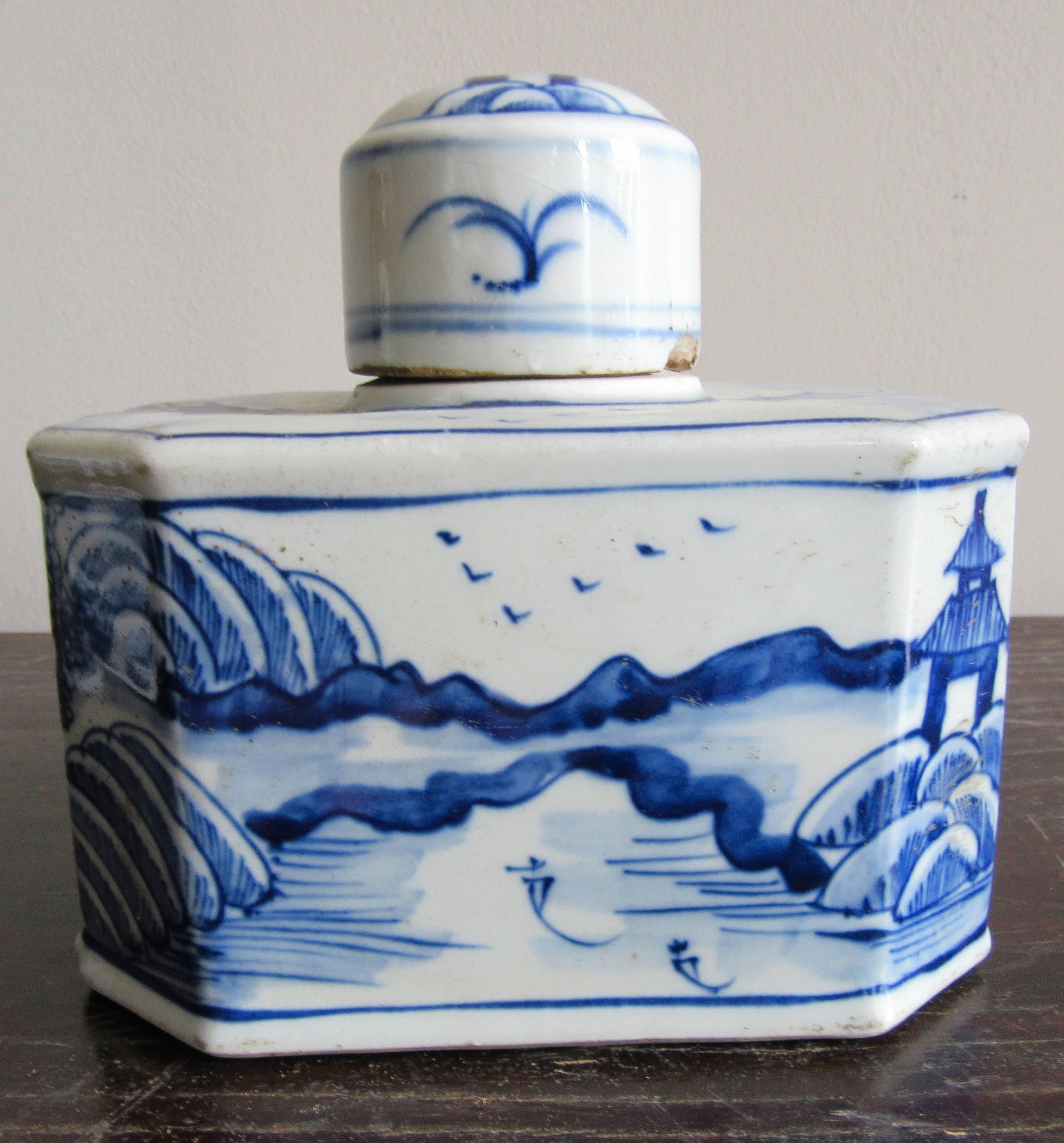 Unusual petite pair of Chinese porcelain tea canisters. Hand-painted with a landscape motif. Sourced from the markets of Jingdezhen, China, home to the Imperial kilns of the Emperors. This region has been renowned for centuries for its excellence in