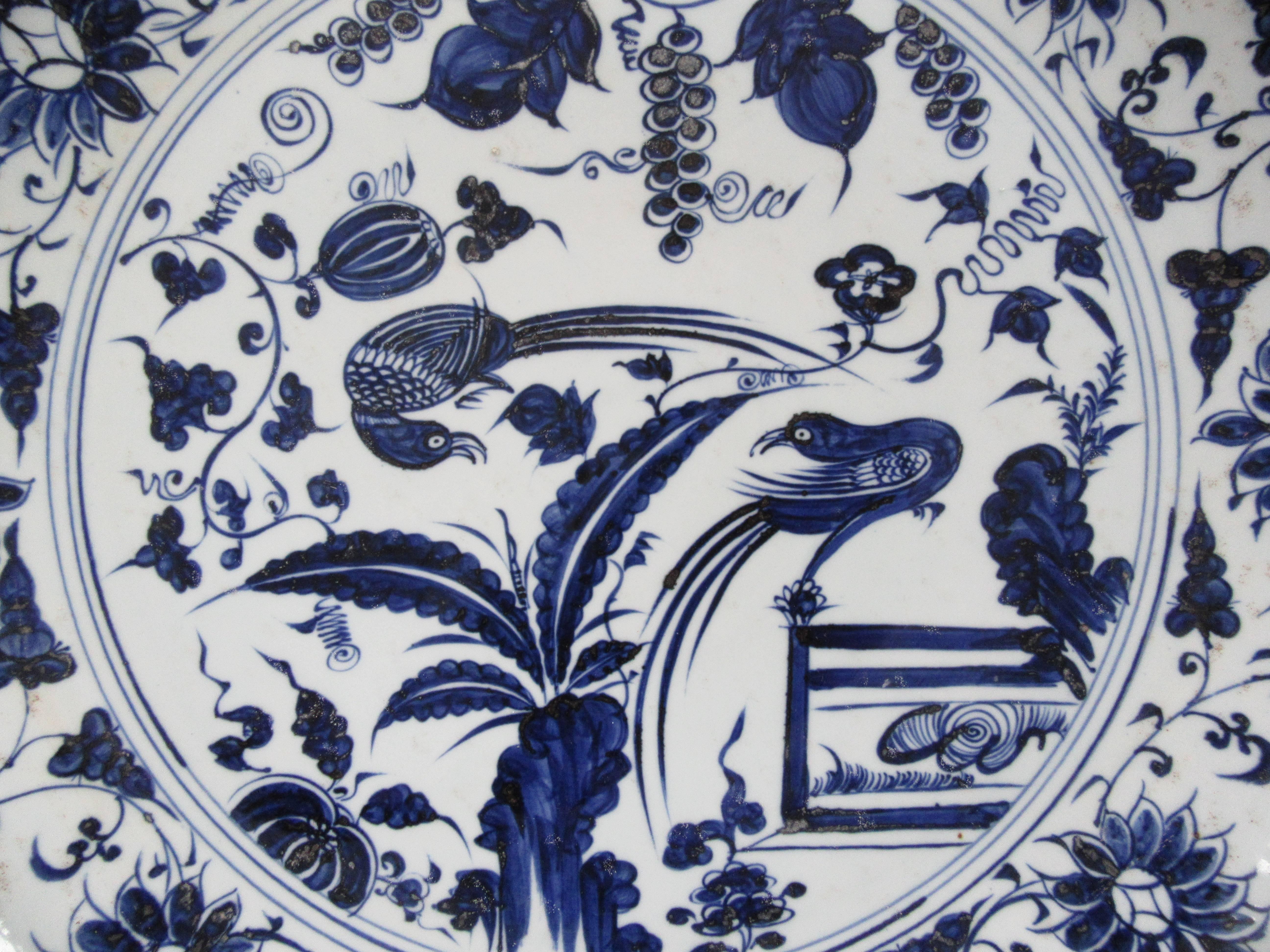 Striking blue and white porcelain charger in the style of the Ming dynasty. Hand-painted in a traditional songbird motif with scalloped edge. This impressively sized charger was found in Jingdezhen, China where the imperial kilns of the emperors